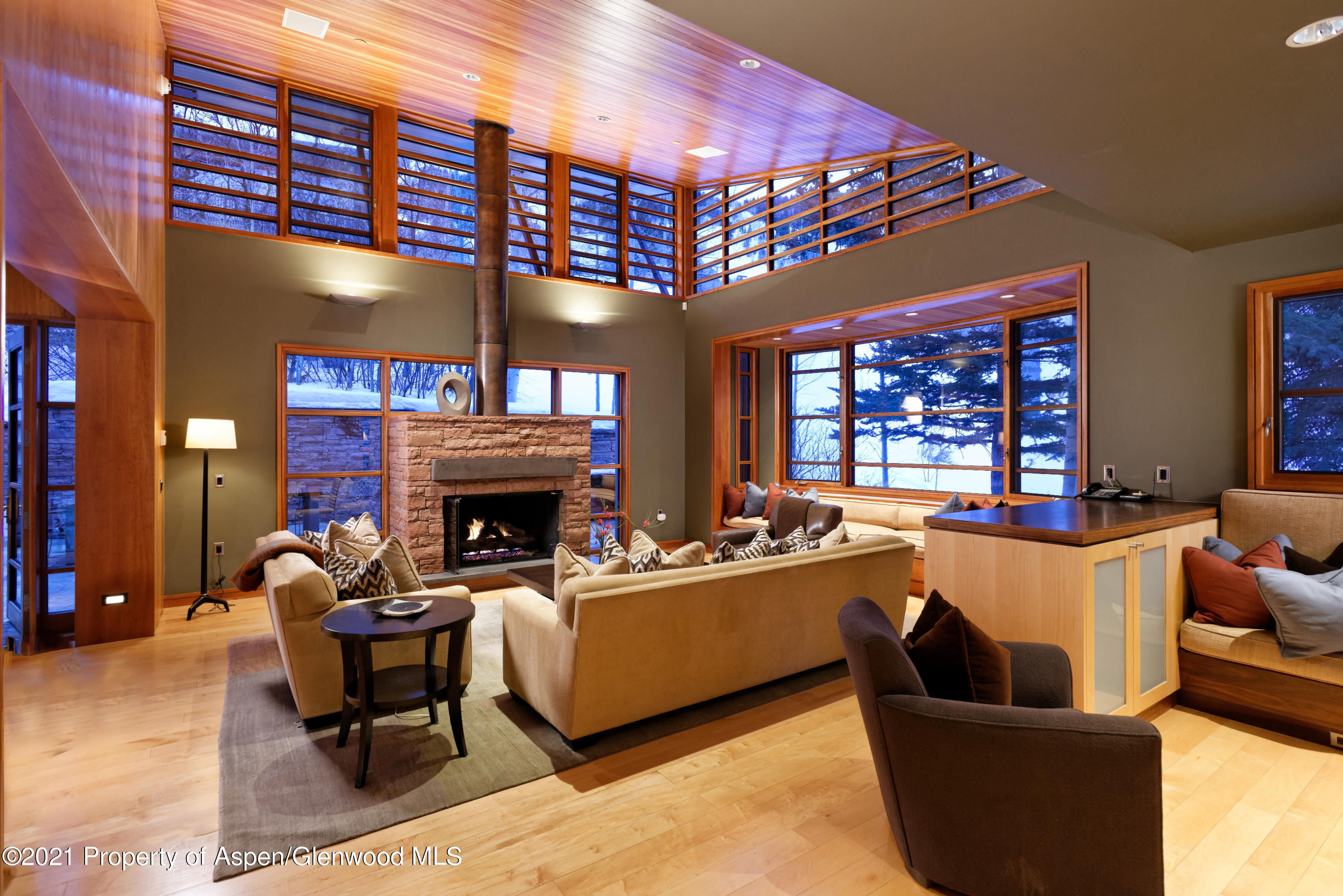 550 Aspen Alps Road South Aspen, CO 81611 - Photo 27 of 58 a living room with furniture a fireplace and potted plants