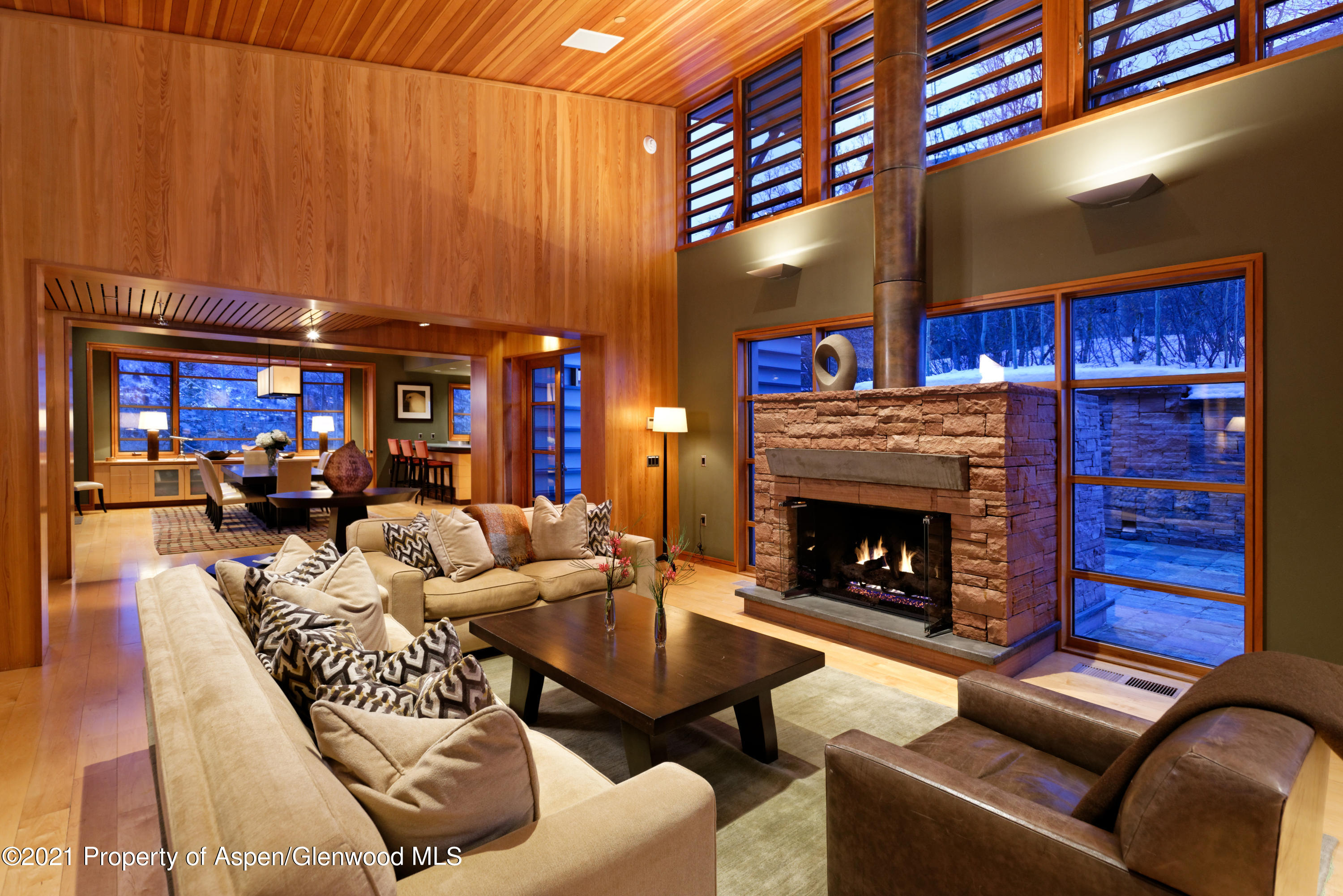 550 Aspen Alps Road South Aspen, CO 81611 - Photo 30 of 58 a living room with furniture a fireplace and a flat screen tv
