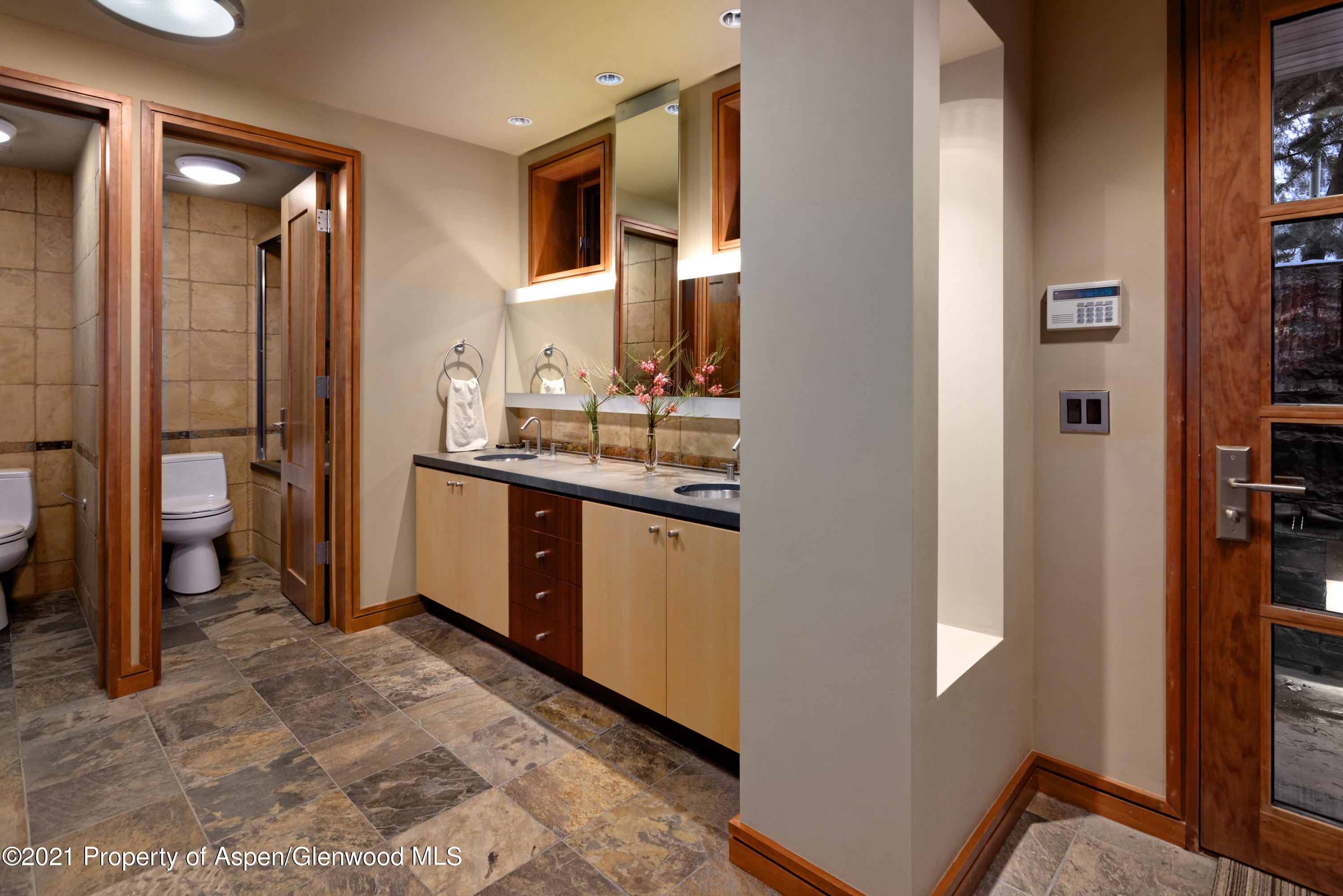 550 Aspen Alps Road South Aspen, CO 81611 - Photo 38 of 58 a kitchen with a sink and a refrigerator