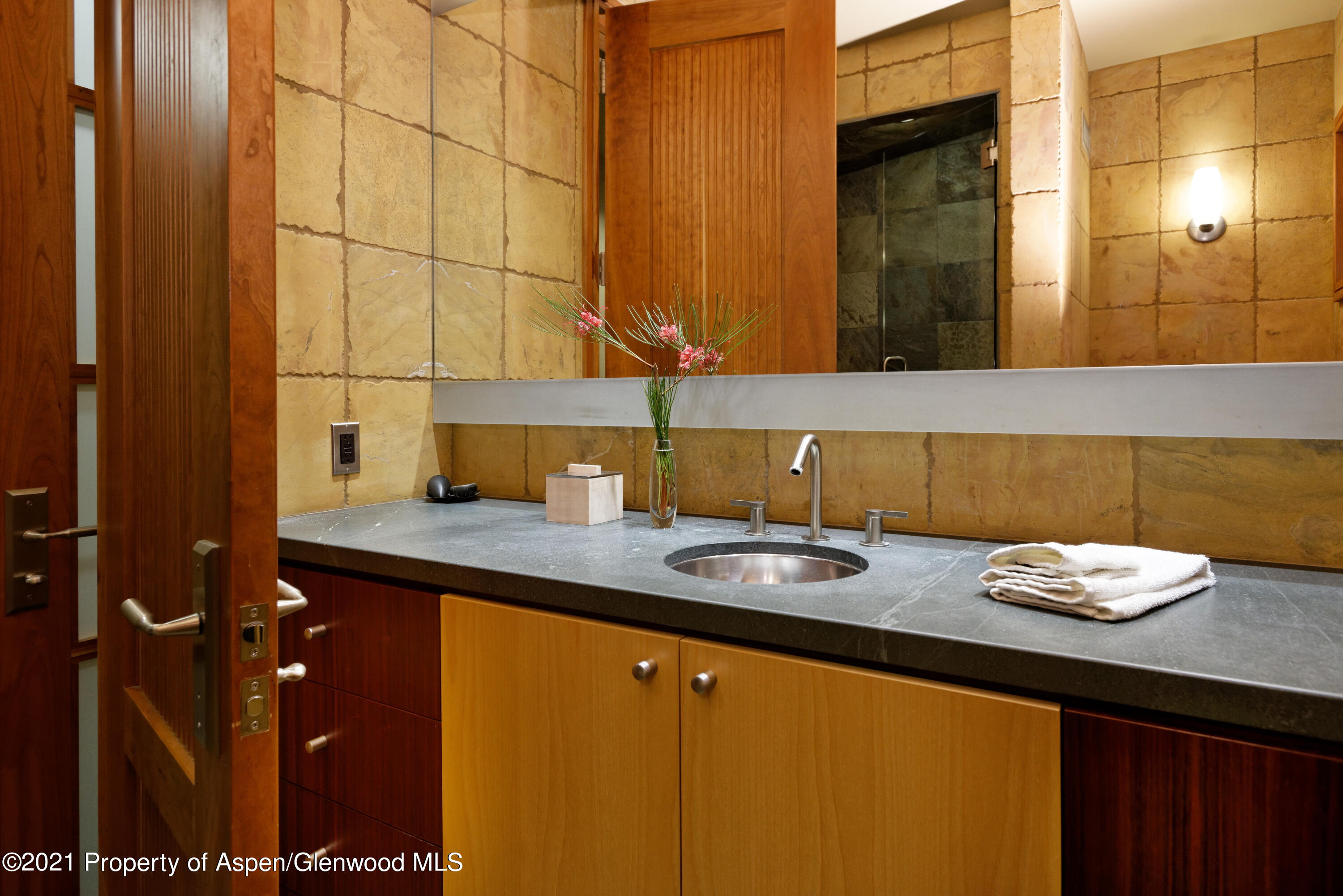 550 Aspen Alps Road South Aspen, CO 81611 - Photo 40 of 58 a bathroom with a sink and a mirror