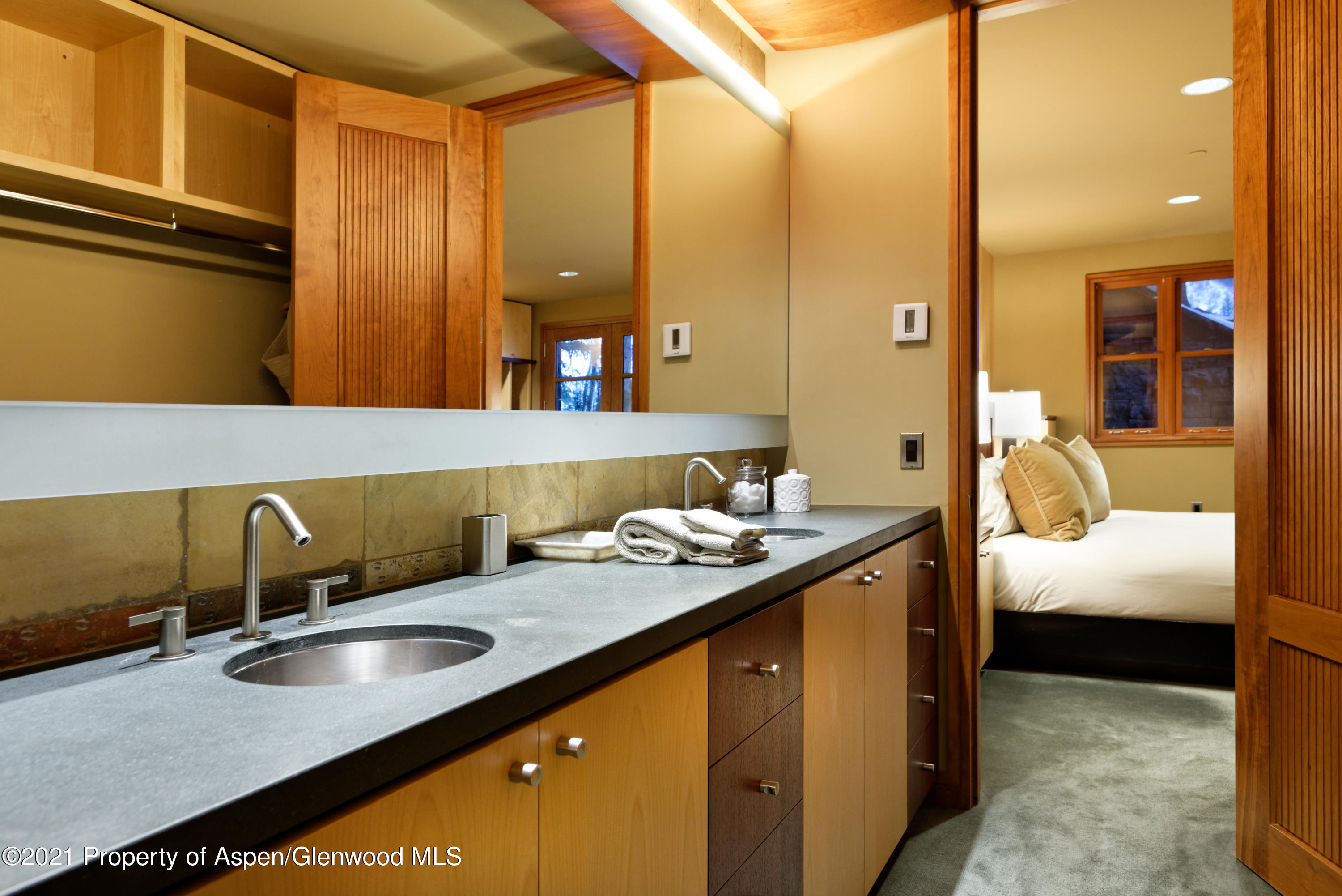 550 Aspen Alps Road South Aspen, CO 81611 - Photo 44 of 58 a bathroom with a granite countertop sink and a mirror