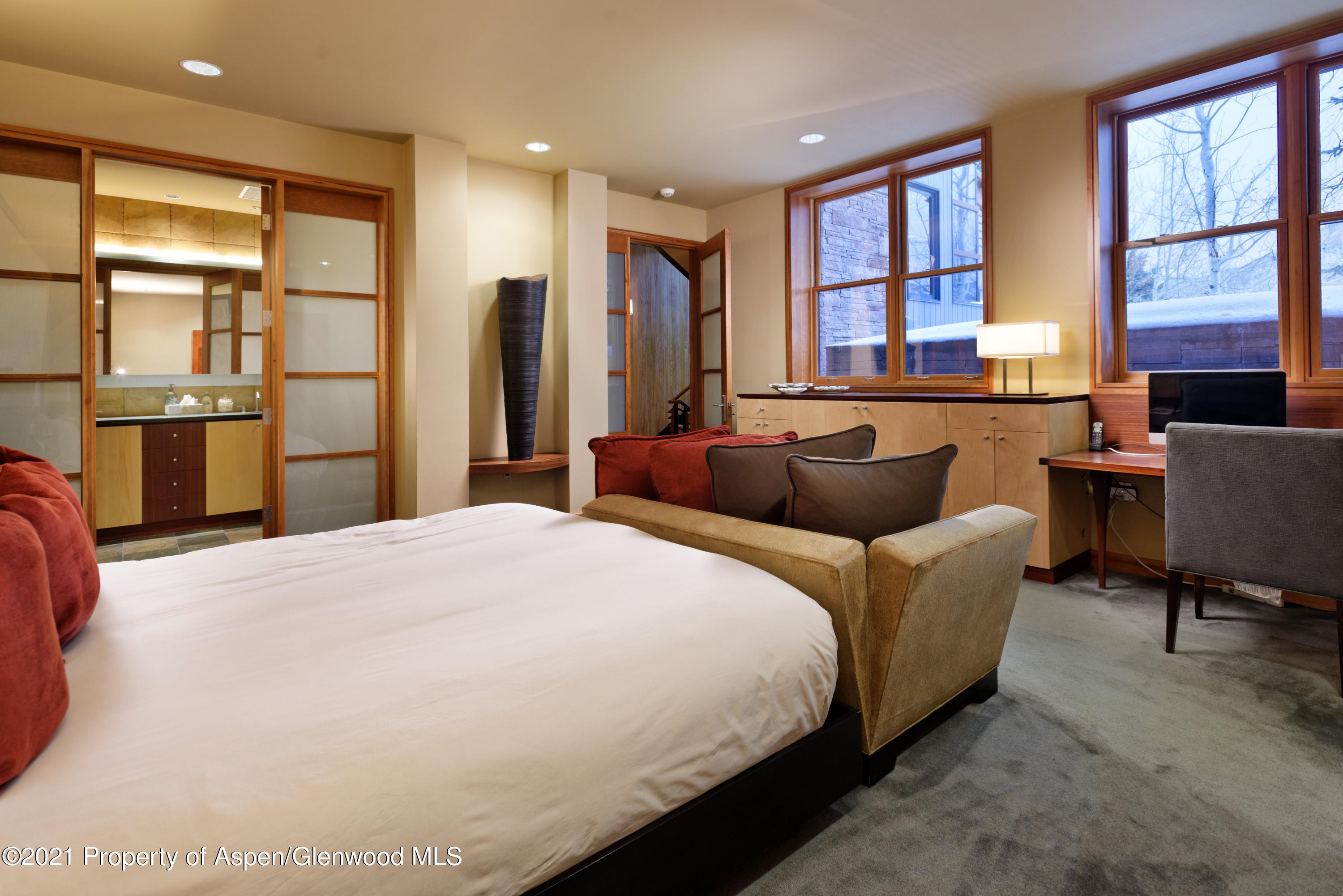 550 Aspen Alps Road South Aspen, CO 81611 - Photo 45 of 58 a bedroom with a bed and wooden floor