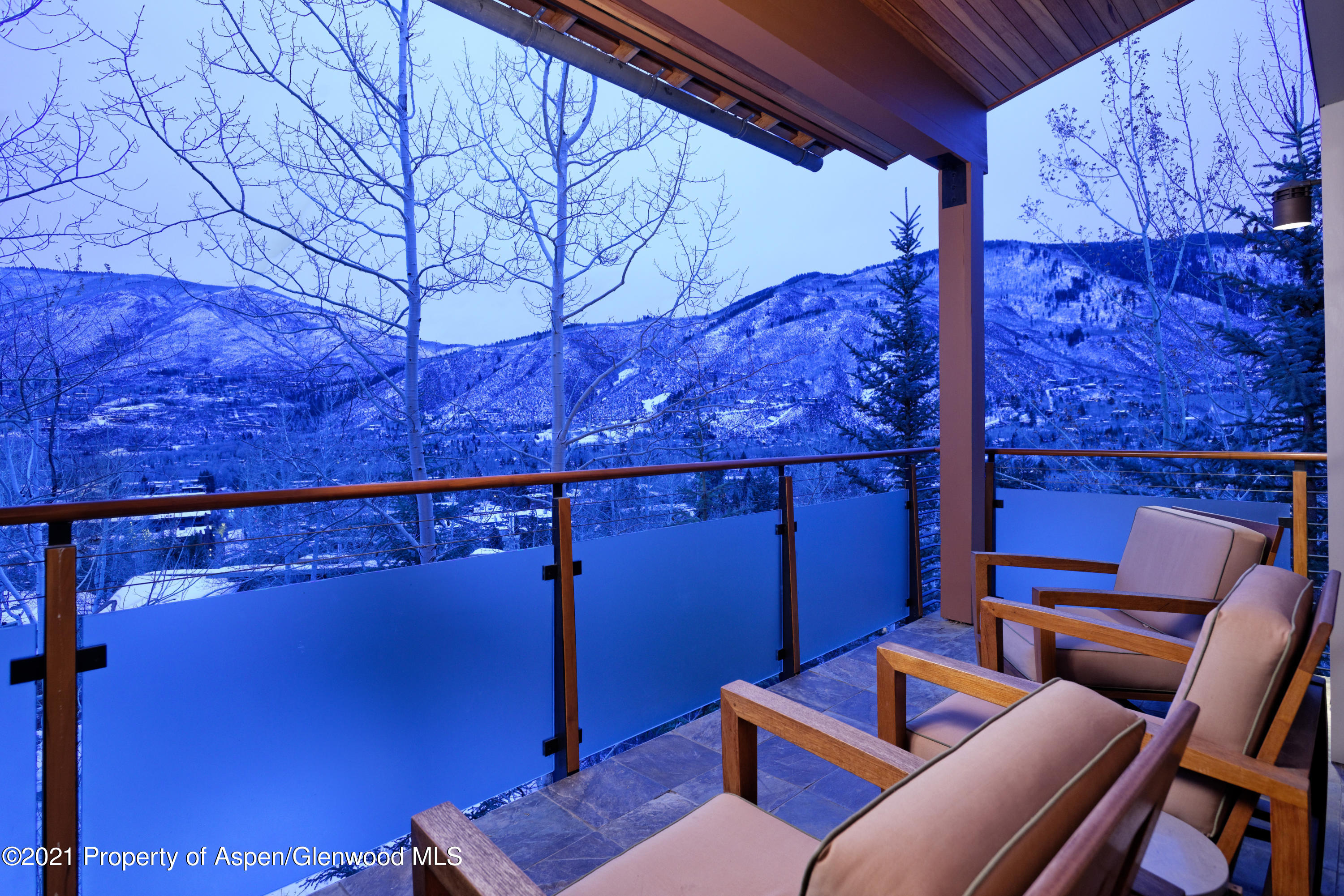 550 Aspen Alps Road South Aspen, CO 81611 - Photo 54 of 58 a blue chair sitting in a room next to a blue wall