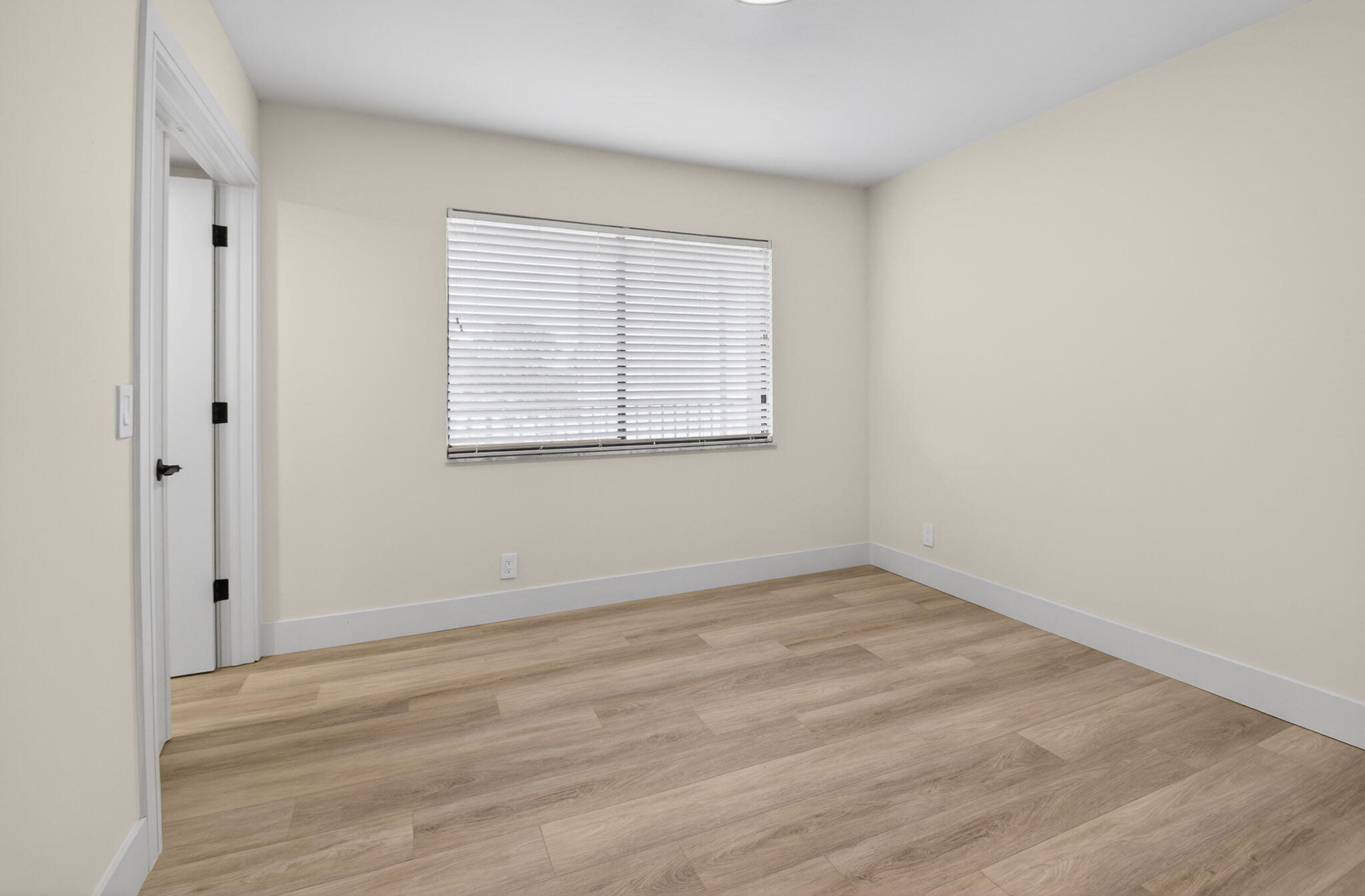 14475 Strathmore Lane, Unit 305 Delray Beach, FL 33446 - Photo 20 of 27 an empty room with a window