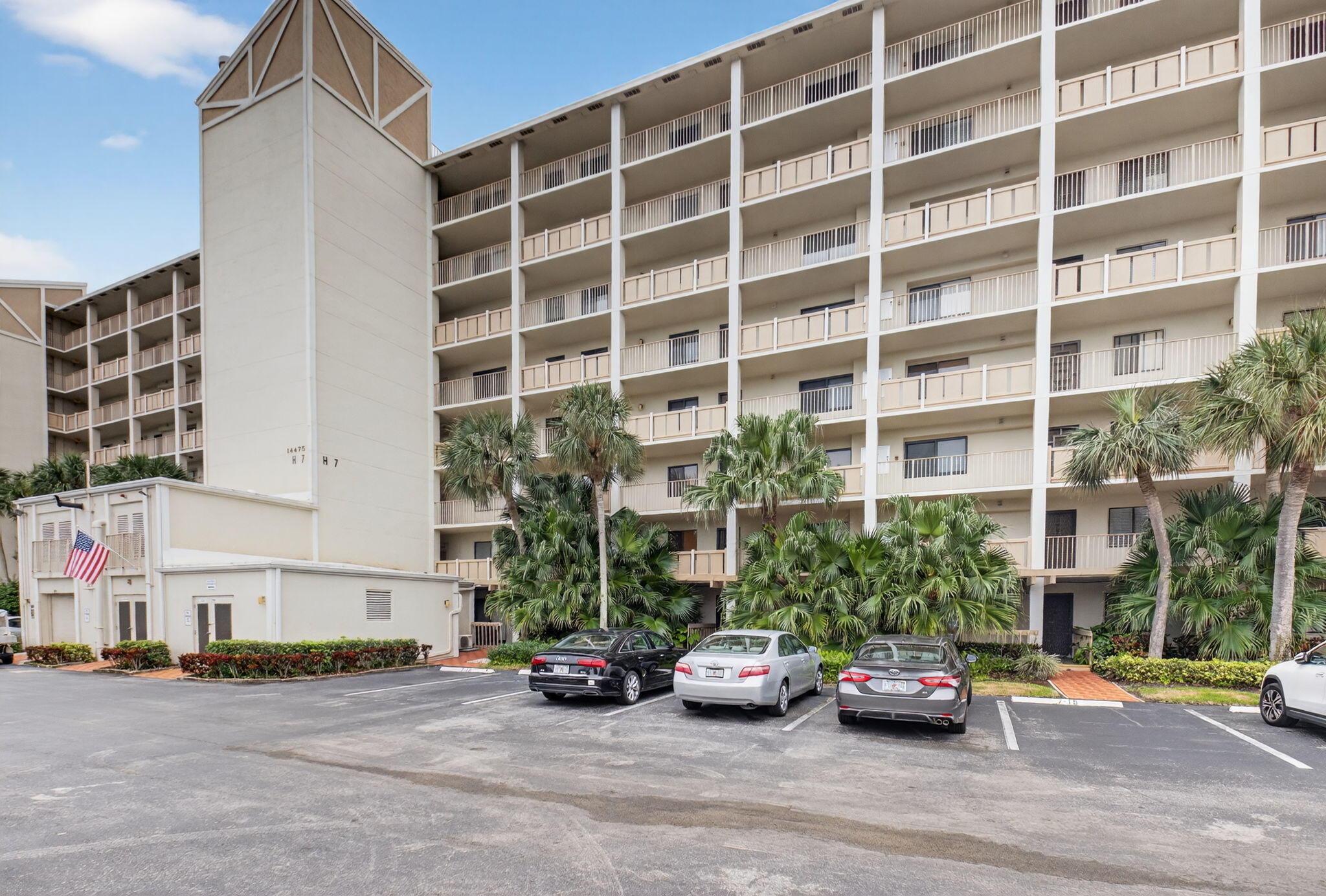 14475 Strathmore Lane, Unit 305 Delray Beach, FL 33446 - Photo 26 of 27 a car parked in front of a building