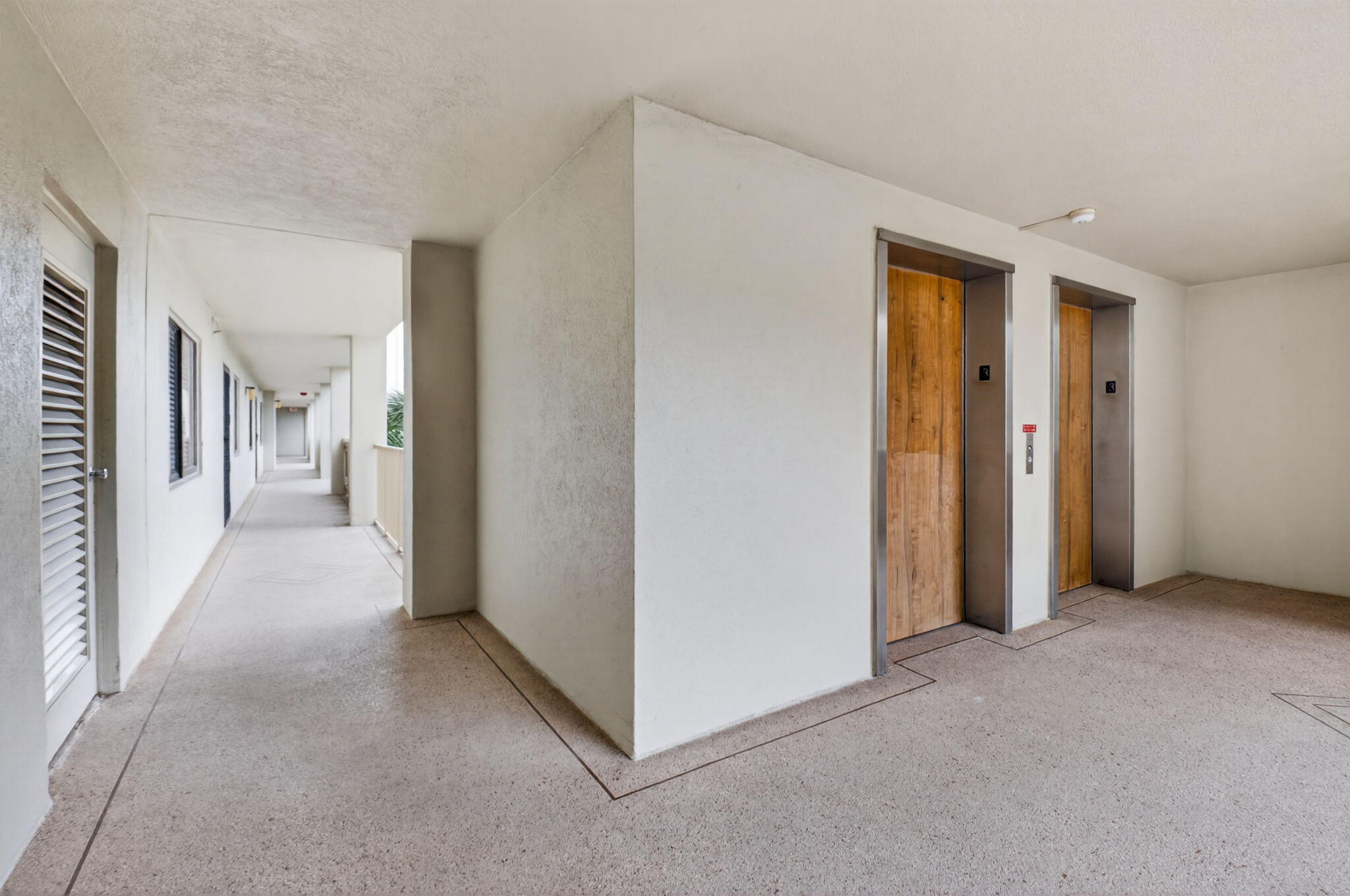 14475 Strathmore Lane, Unit 305 Delray Beach, FL 33446 - Photo 27 of 27 a view of a hallway with bathroom