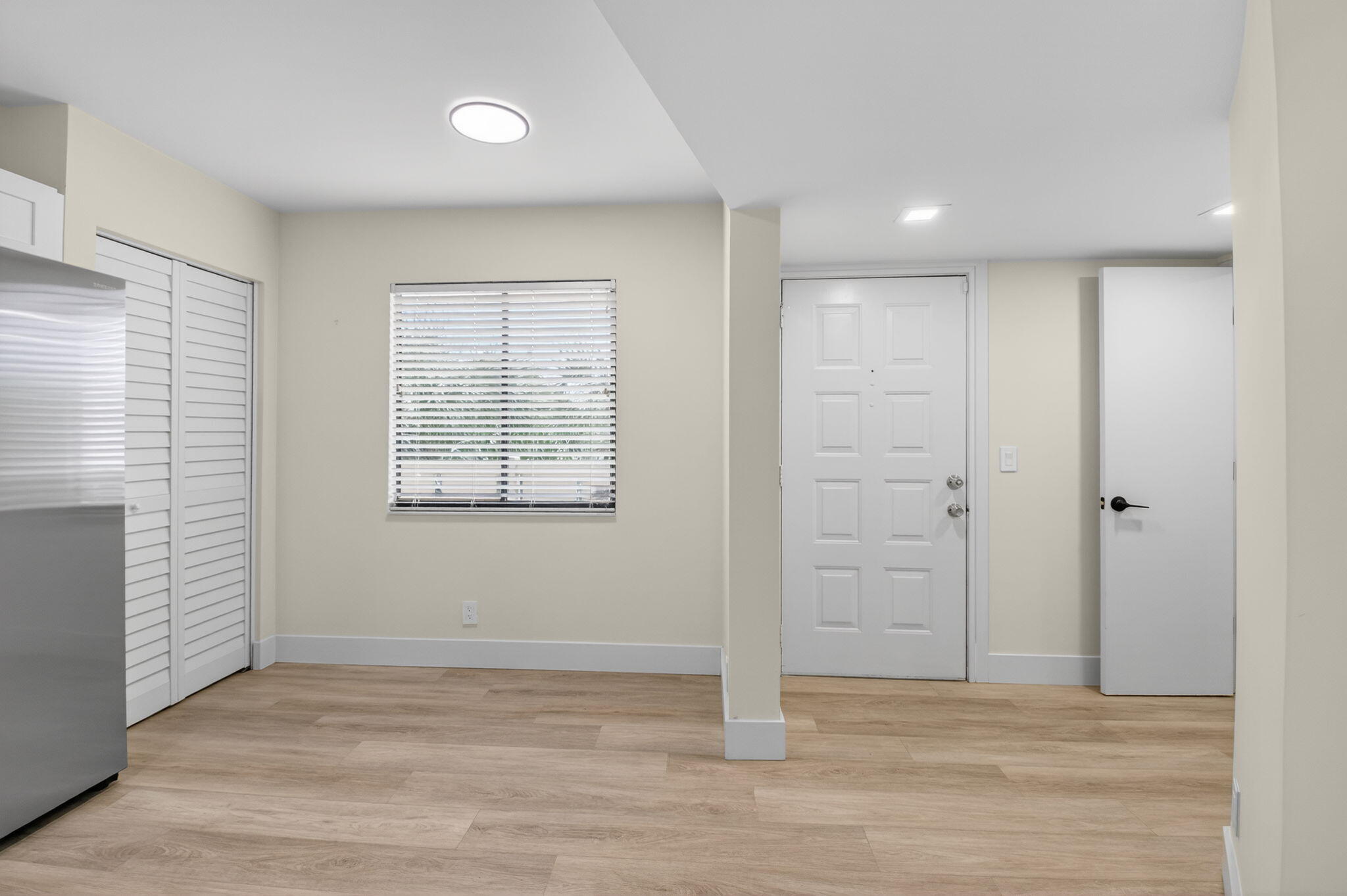 14475 Strathmore Lane, Unit 305 Delray Beach, FL 33446 - Photo 3 of 27 an empty room with windows and closet