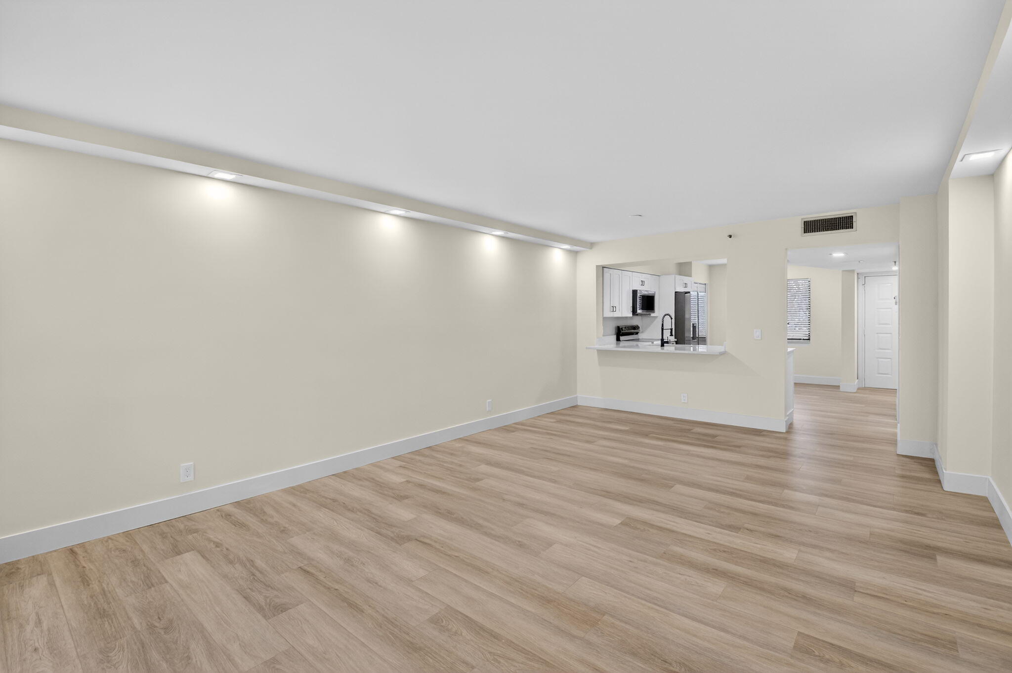 14475 Strathmore Lane, Unit 305 Delray Beach, FL 33446 - Photo 9 of 27 a view of empty room with wooden floor