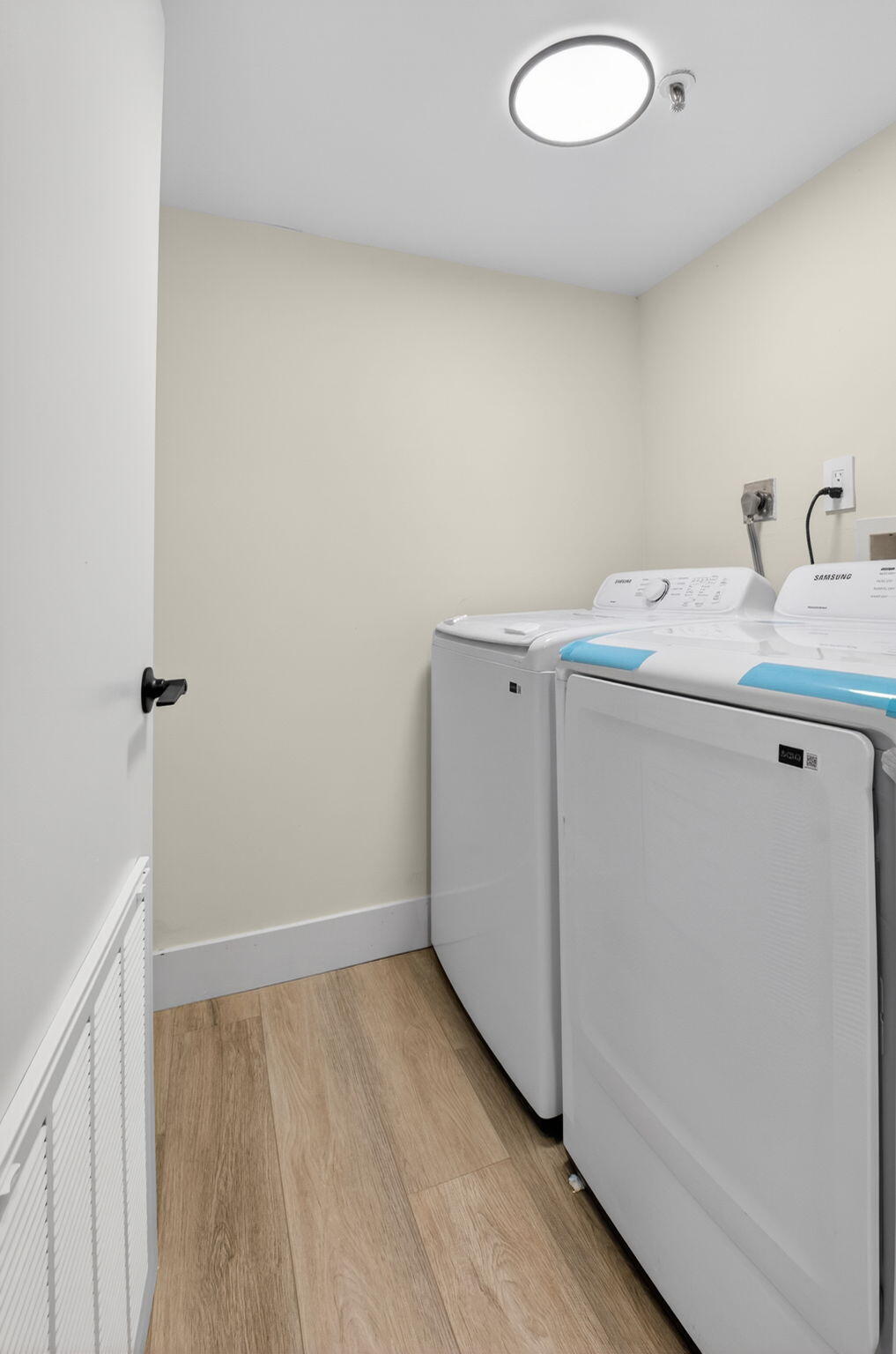 14475 Strathmore Lane, Unit 305 Delray Beach, FL 33446 - Photo 10 of 27 a room with a sink and wooden floor