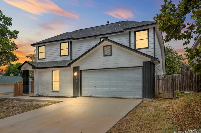 a front view of a house with a garage