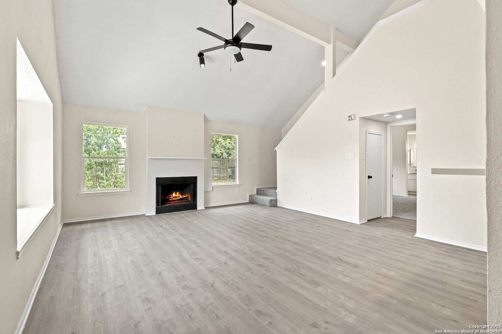 6403 Gray Ridge San Antonio, TX 78233 - Photo 12 of 50 wooden floor fireplace and windows in an empty room