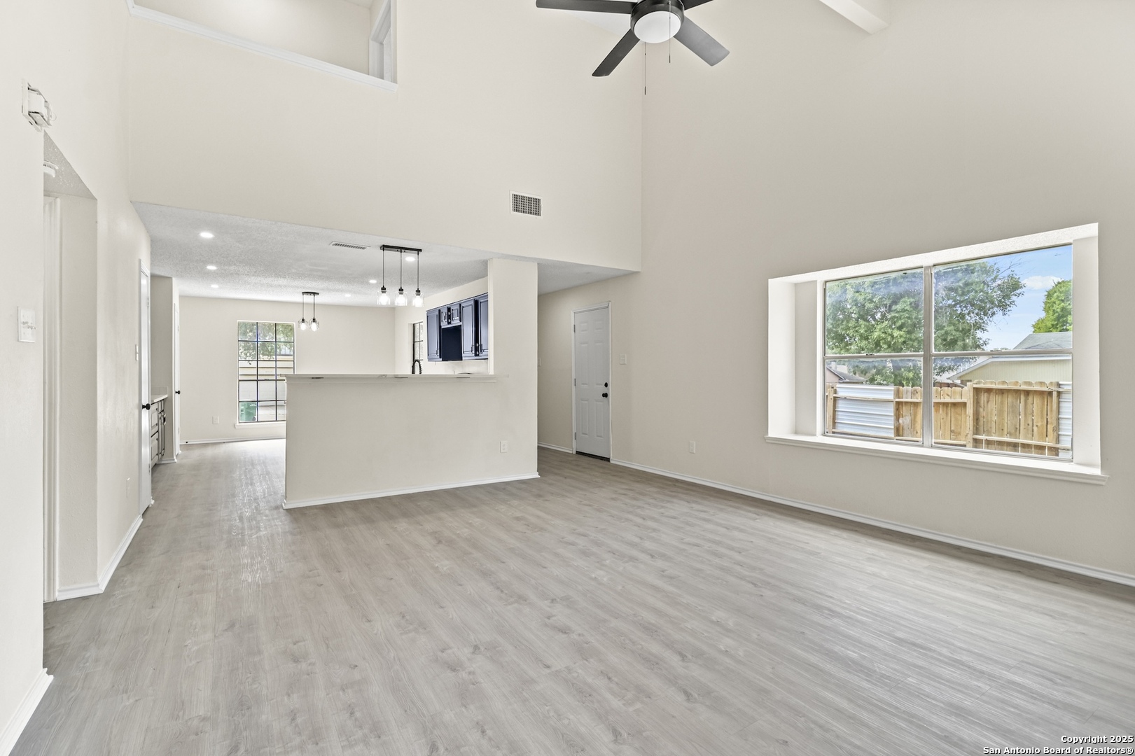 6403 Gray Ridge San Antonio, TX 78233 - Photo 13 of 50 a view of a kitchen with wooden floor and windows