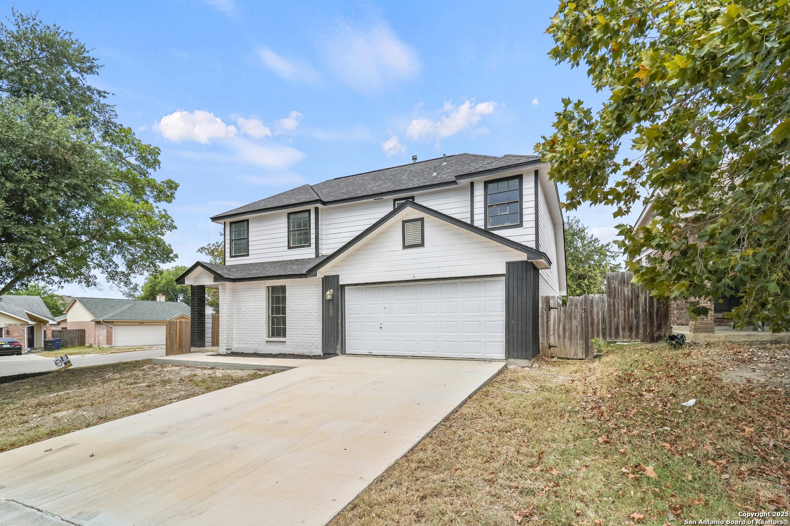 6403 Gray Ridge San Antonio, TX 78233 - Photo 15 of 50 a front view of a house with a yard and garage
