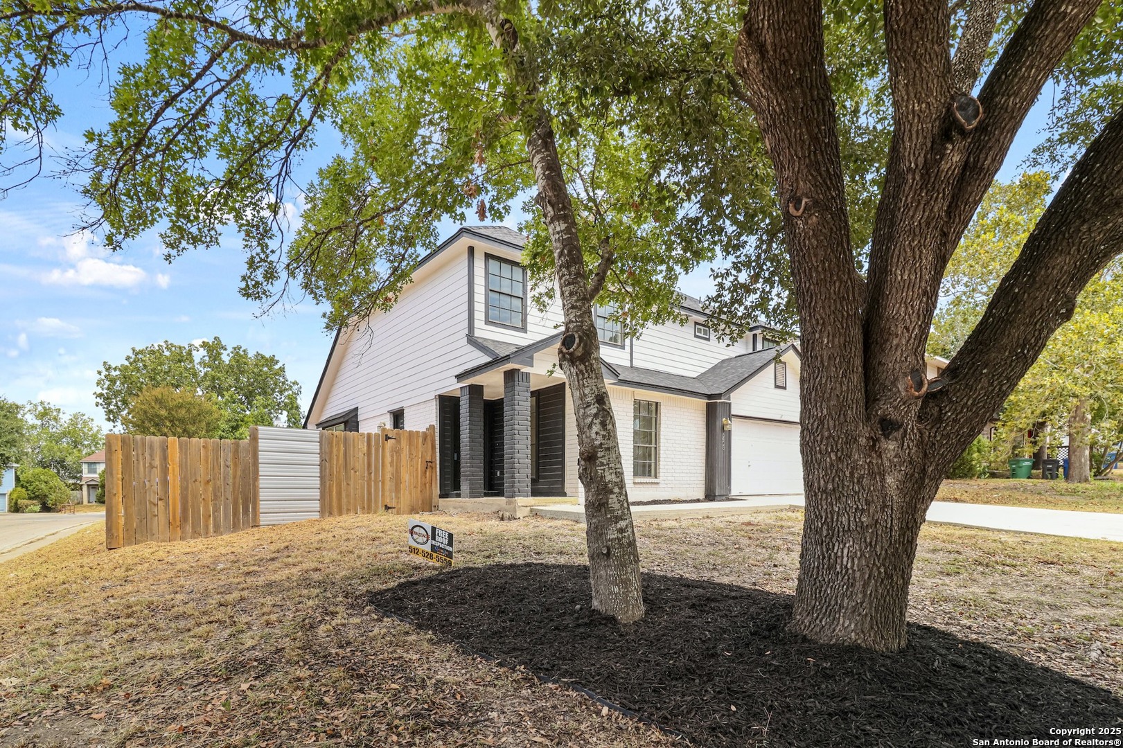 6403 Gray Ridge San Antonio, TX 78233 - Photo 18 of 50 a front view of a house with a tree