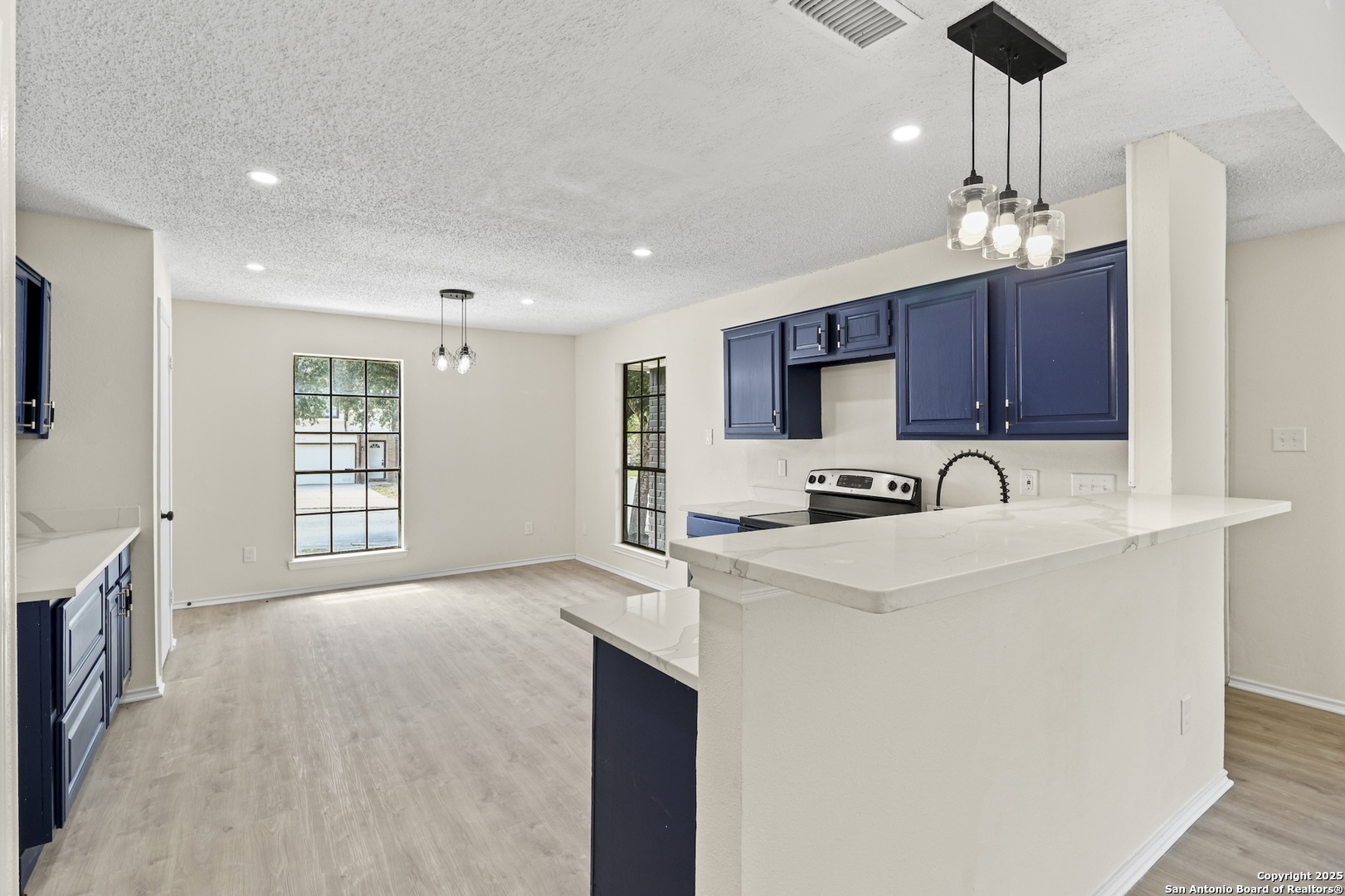 6403 Gray Ridge San Antonio, TX 78233 - Photo 22 of 50 a kitchen with stainless steel appliances granite countertop a sink refrigerator and cabinets