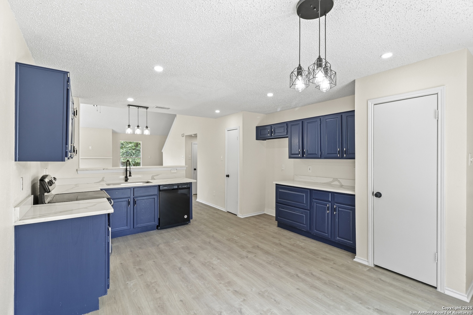 6403 Gray Ridge San Antonio, TX 78233 - Photo 24 of 50 a large kitchen with stainless steel appliances granite countertop a sink refrigerator and cabinets