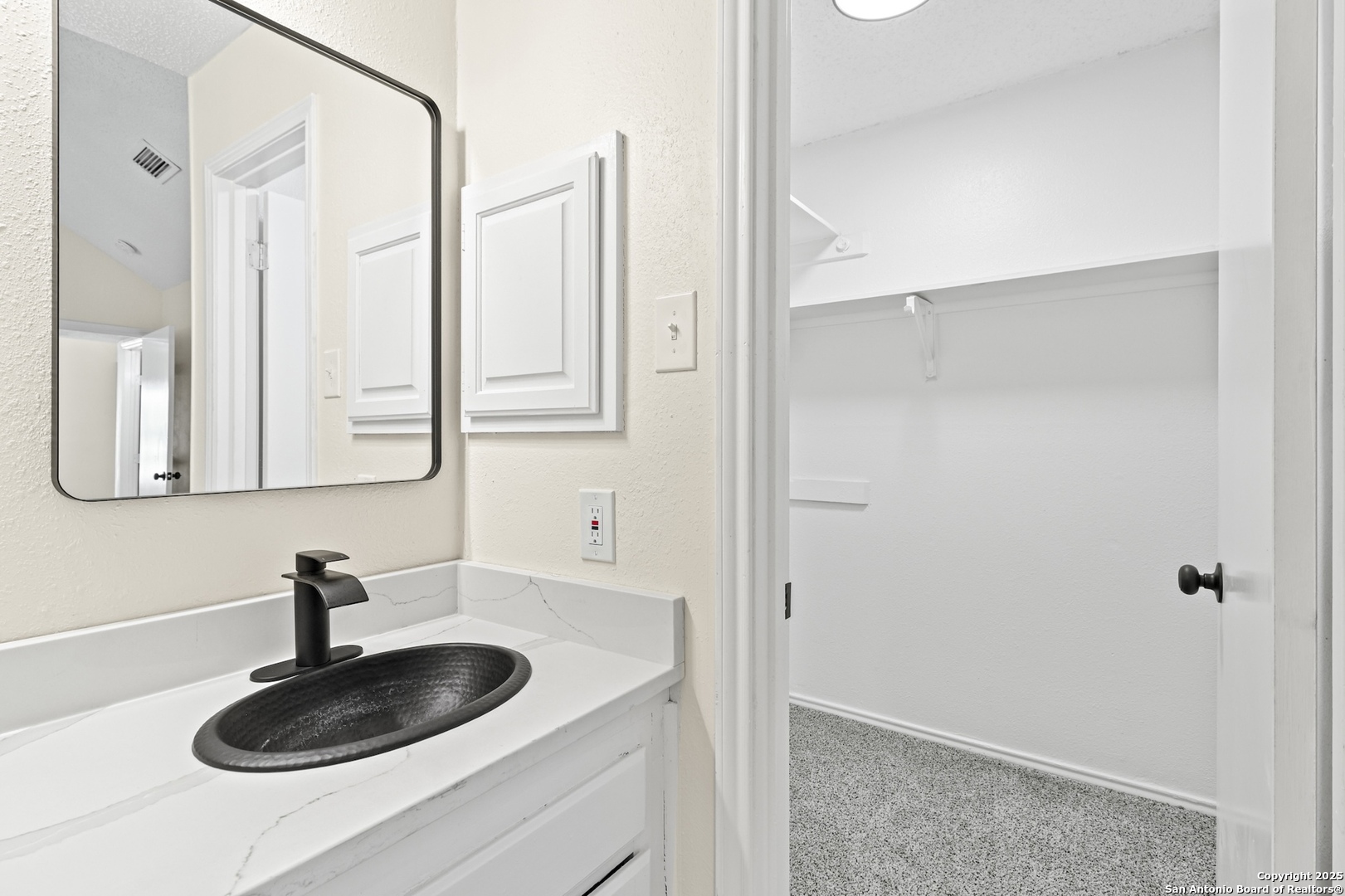 6403 Gray Ridge San Antonio, TX 78233 - Photo 32 of 50 a bathroom with a sink and a mirror