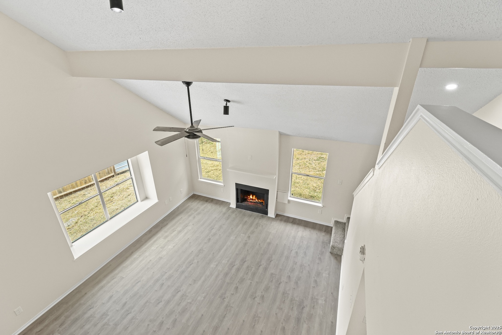 6403 Gray Ridge San Antonio, TX 78233 - Photo 34 of 50 a view of a livingroom with wooden floor and a ceiling fan
