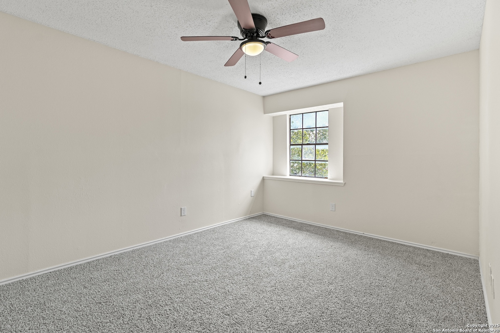 6403 Gray Ridge San Antonio, TX 78233 - Photo 35 of 50 an empty room with a window and a fan