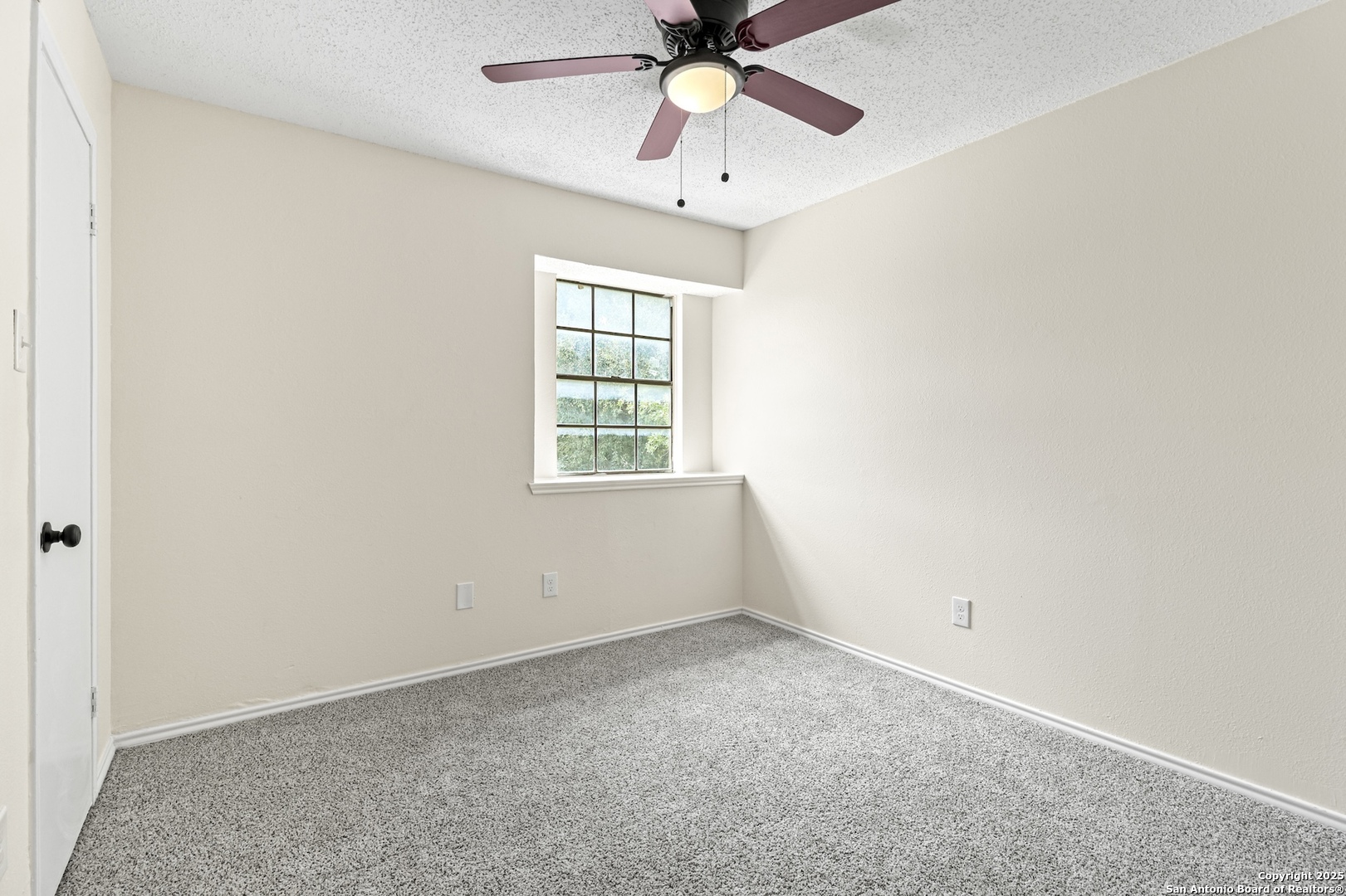 6403 Gray Ridge San Antonio, TX 78233 - Photo 40 of 50 an empty room with a window and a fan