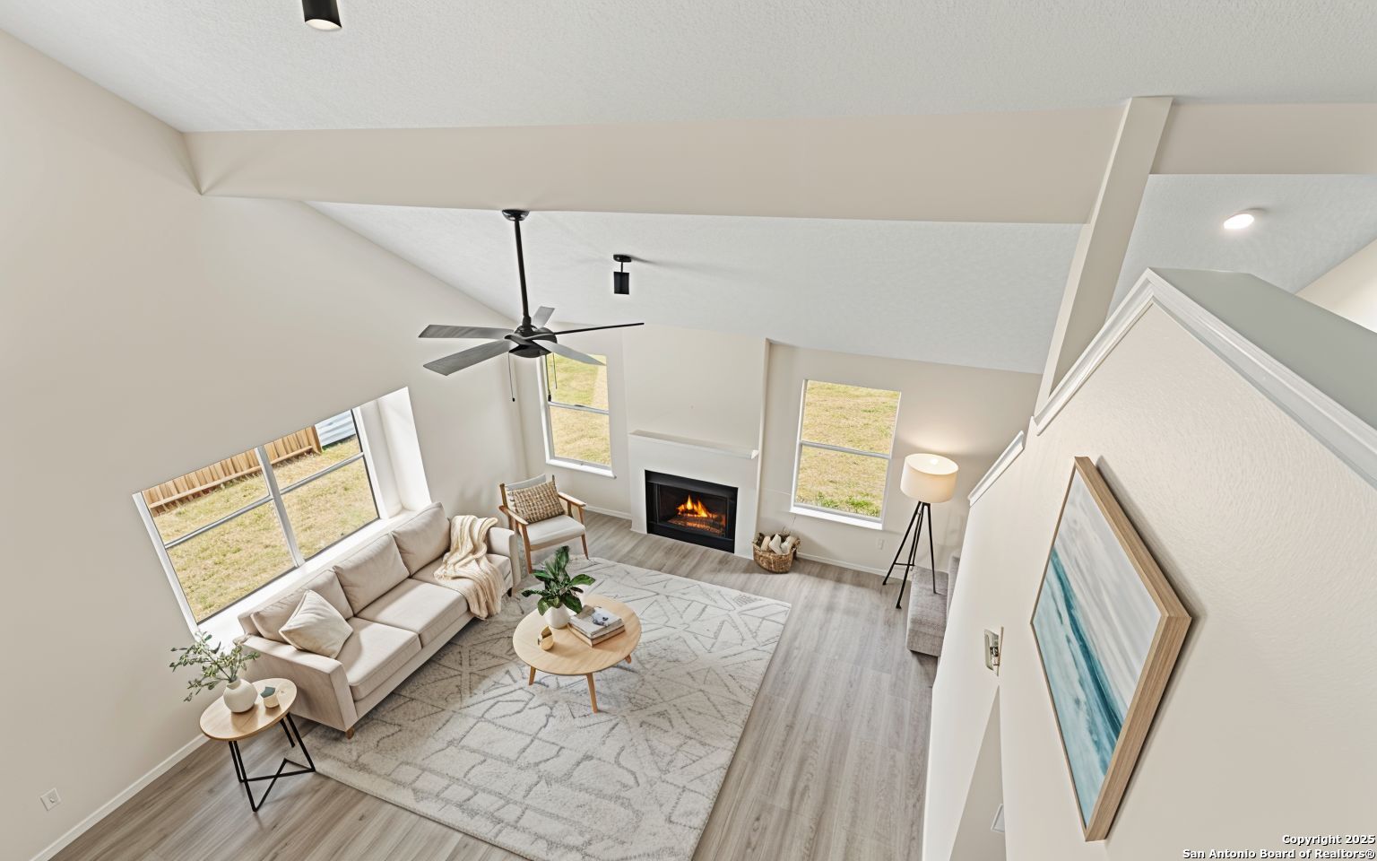 6403 Gray Ridge San Antonio, TX 78233 - Photo 4 of 50 a living room with furniture a fireplace and a flat screen tv