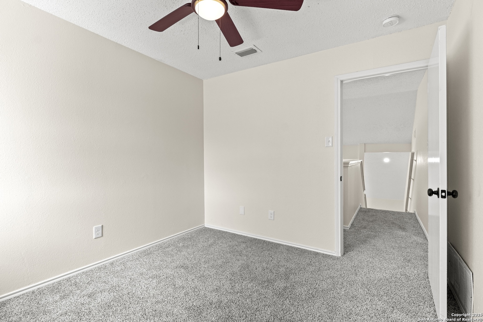 6403 Gray Ridge San Antonio, TX 78233 - Photo 41 of 50 an empty room with chandelier fan