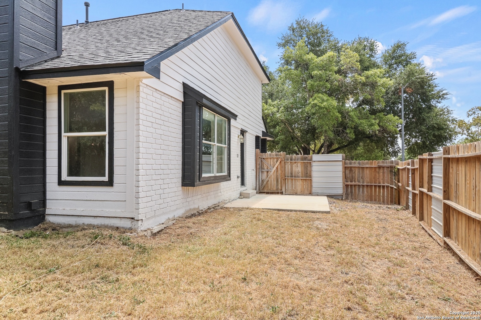 6403 Gray Ridge San Antonio, TX 78233 - Photo 47 of 50 a view of white house with a small yard and large tree