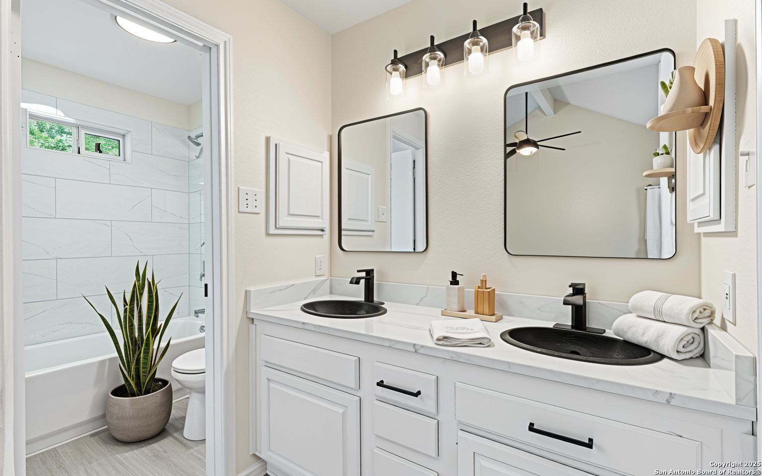 6403 Gray Ridge San Antonio, TX 78233 - Photo 8 of 50 a bathroom with a sink a mirror and a potted plant