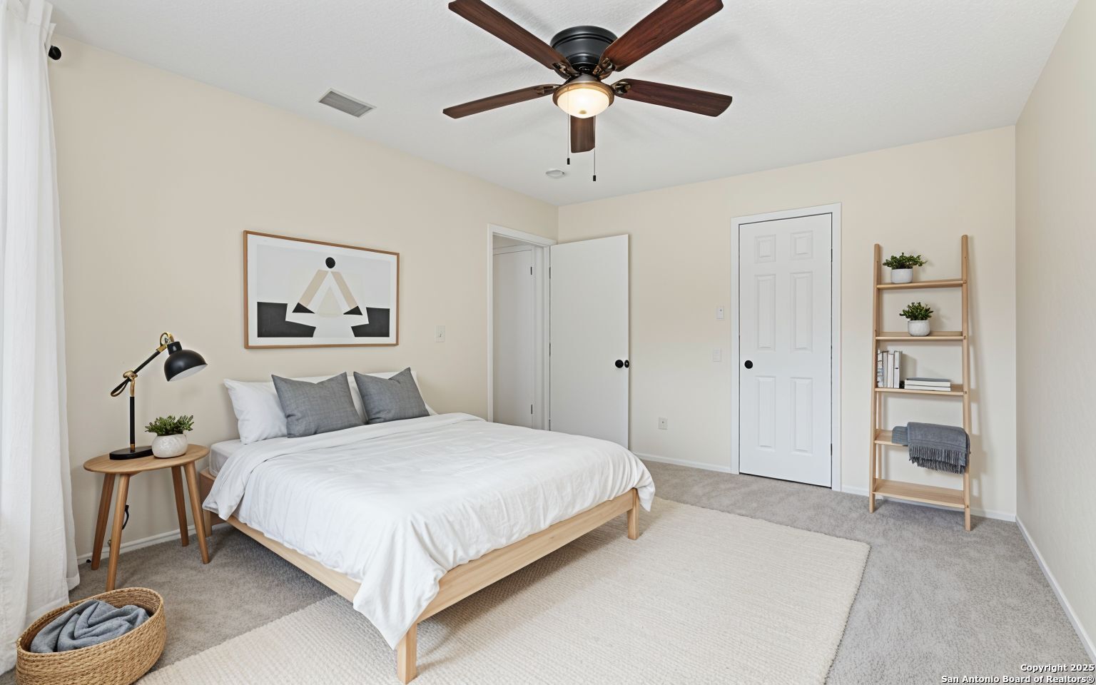 6403 Gray Ridge San Antonio, TX 78233 - Photo 9 of 50 a bedroom with a large bed and a chandelier