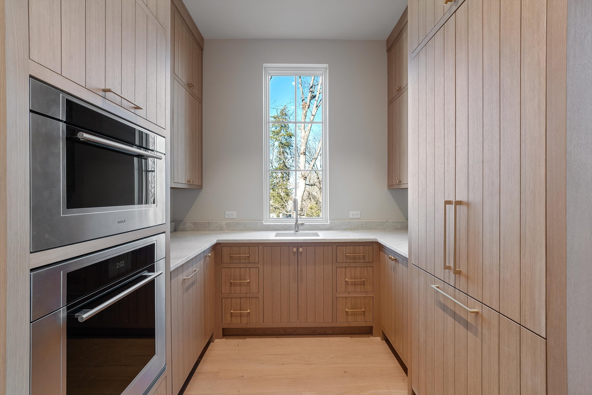4328 Sneed Road Nashville, TN 37215 - Photo 14 of 35 a bathroom with a sink a microwave and cabinets