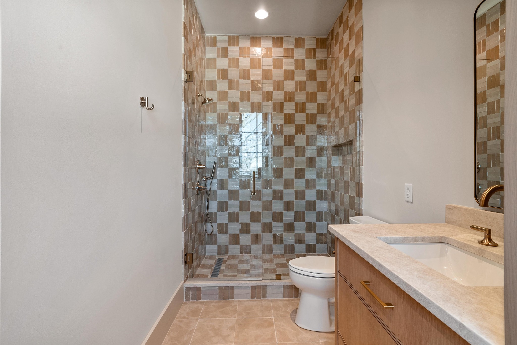 4328 Sneed Road Nashville, TN 37215 - Photo 29 of 35 a bathroom with a granite countertop toilet a sink a shower and a mirror