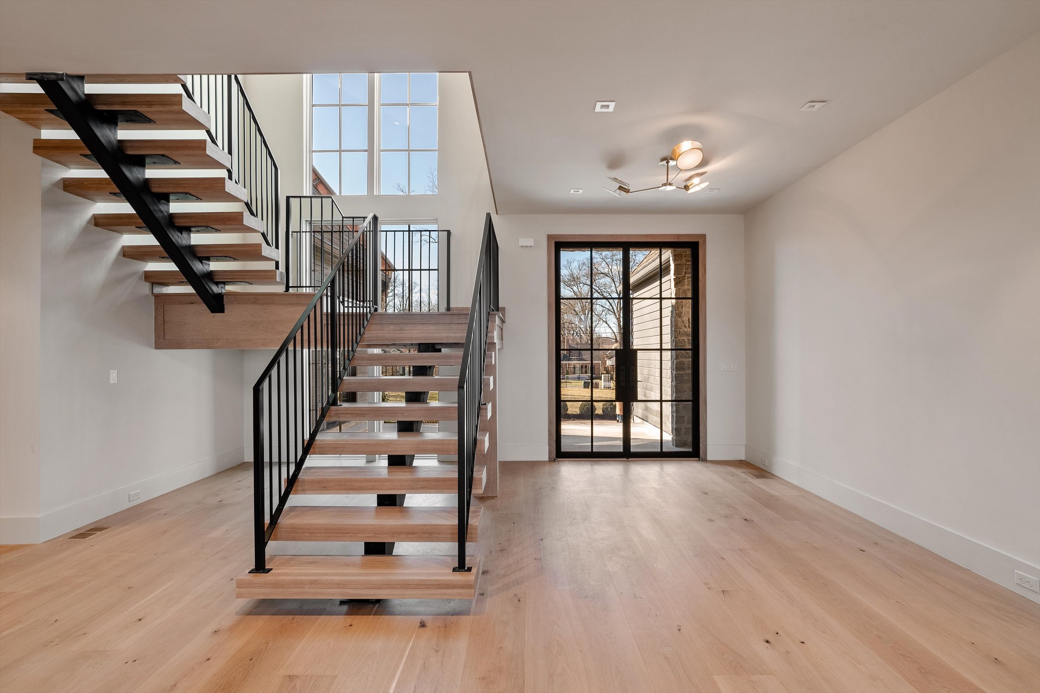 4328 Sneed Road Nashville, TN 37215 - Photo 3 of 35 wooden floor in an empty room with windows