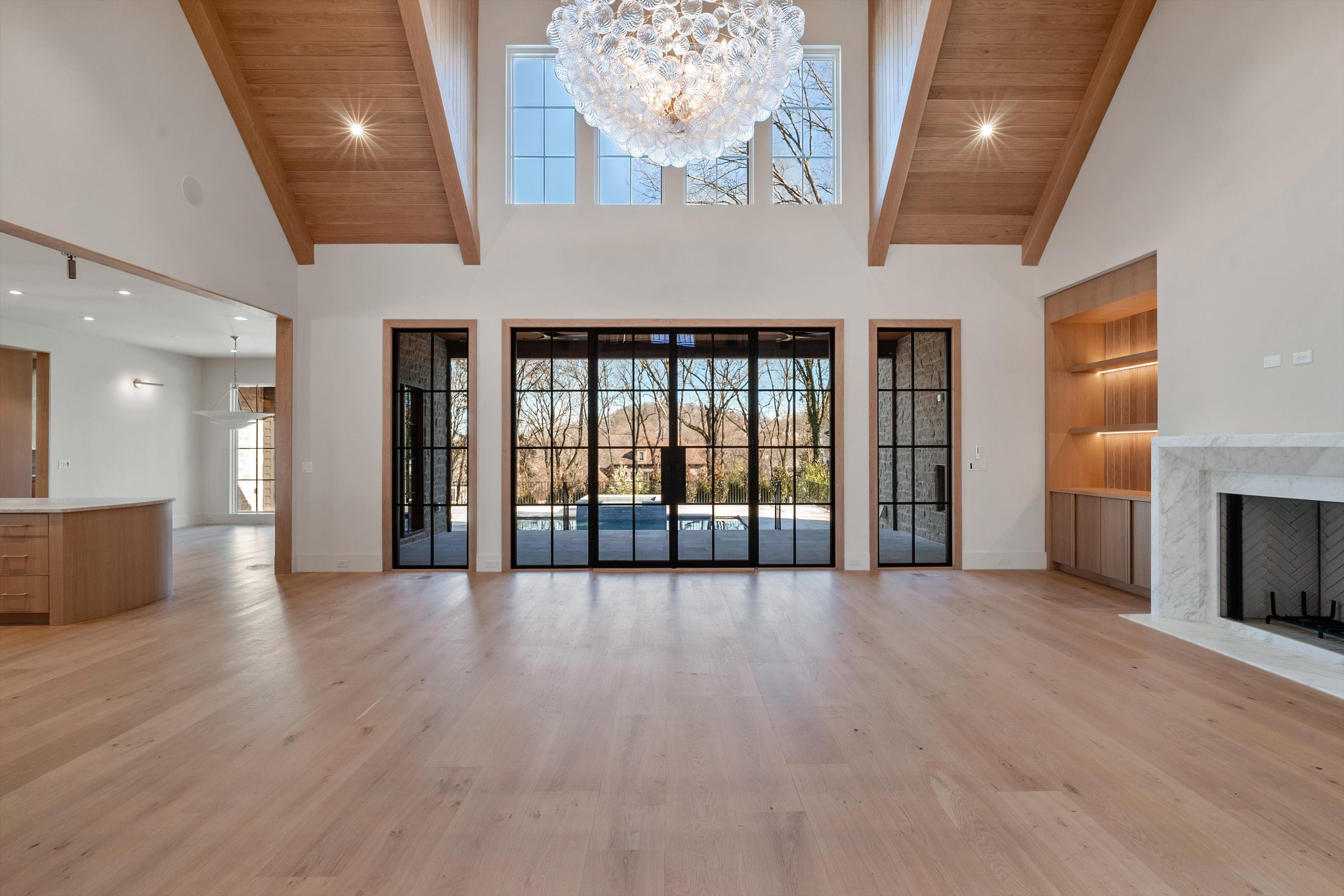 4328 Sneed Road Nashville, TN 37215 - Photo 5 of 35 an empty room with wooden floor and windows