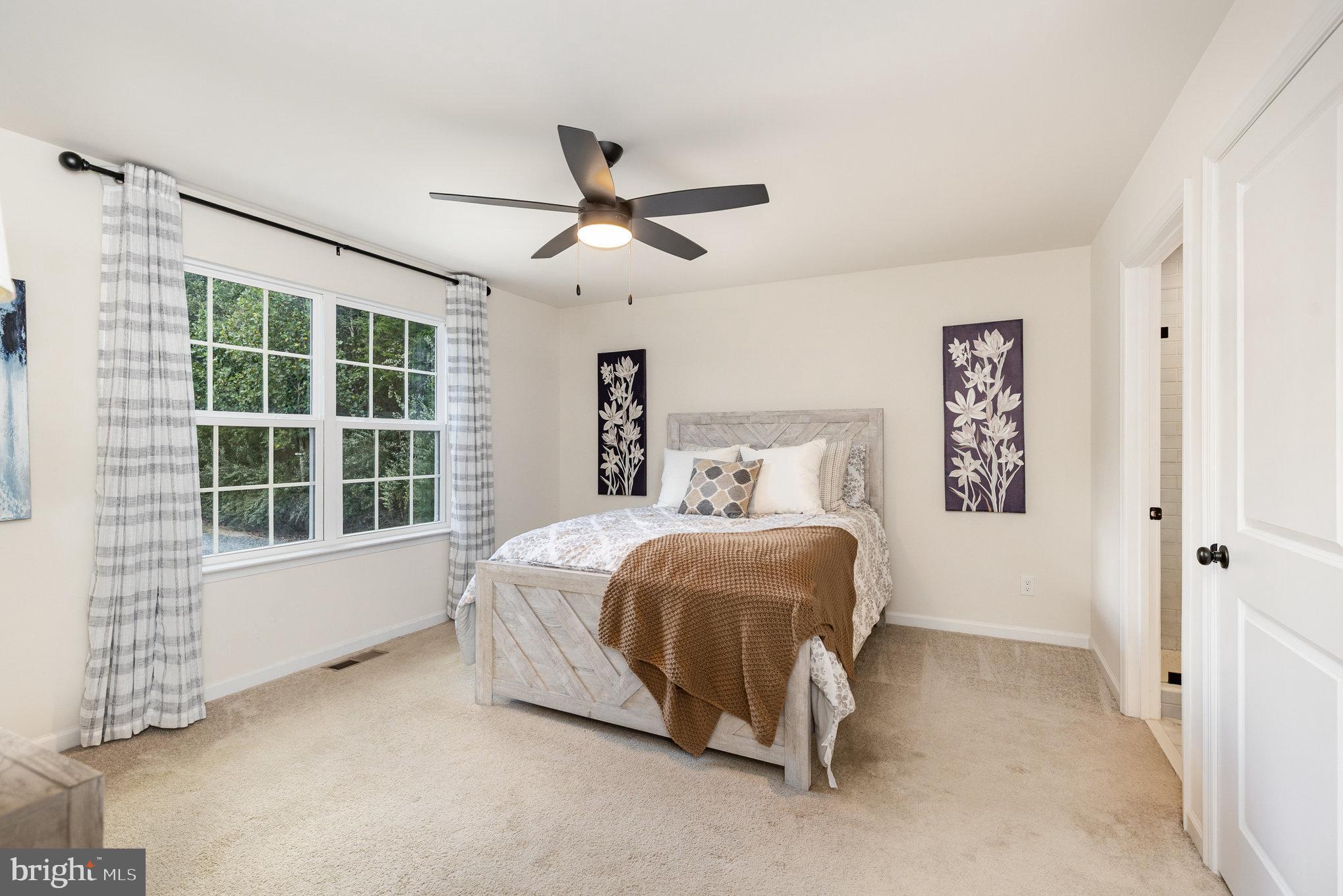 5224 Pendleton Farm Road Bumpass, VA 23024 - Photo 14 of 31 a bedroom with a bed and a large window