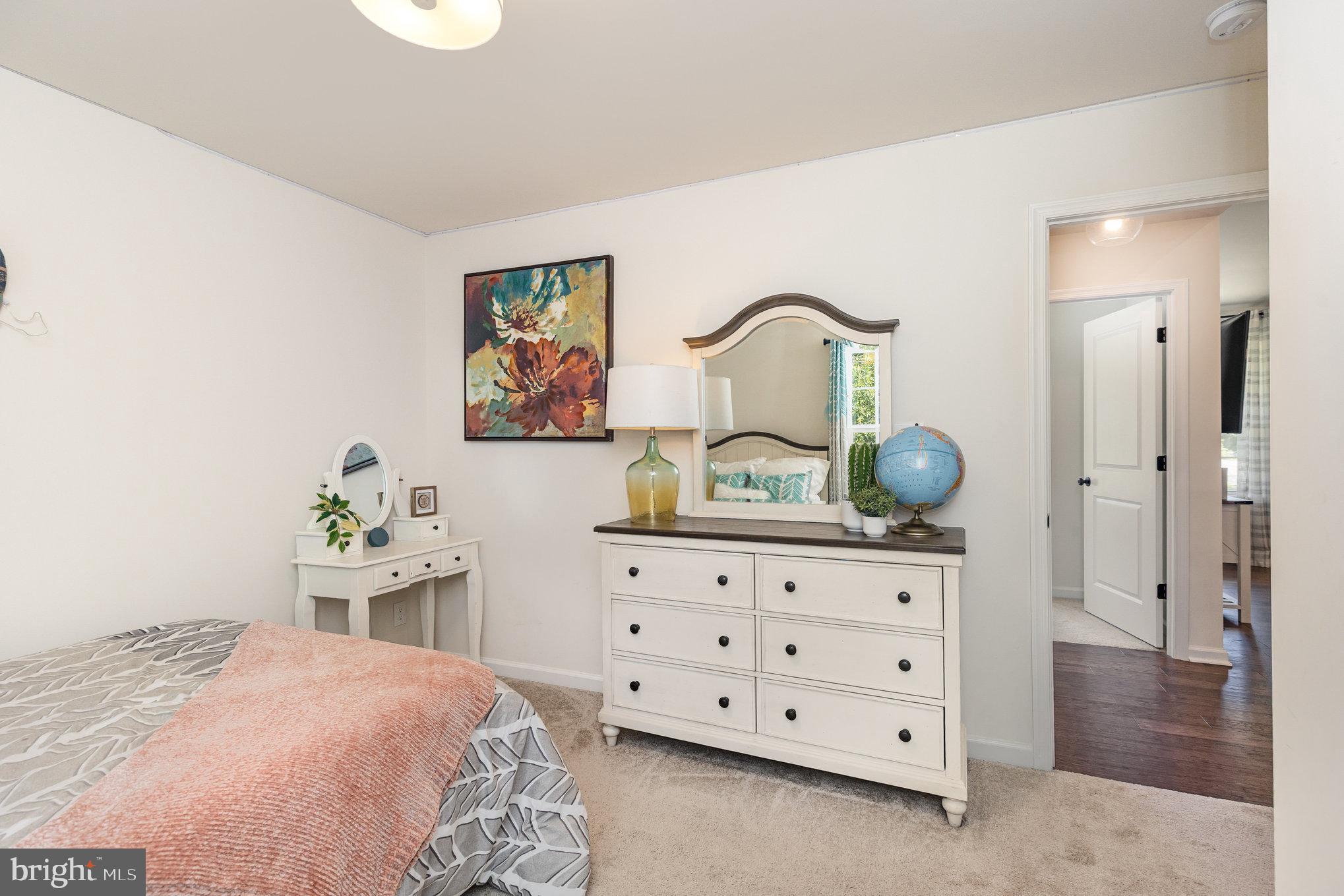 5224 Pendleton Farm Road Bumpass, VA 23024 - Photo 20 of 31 a bedroom with a bed and dresser