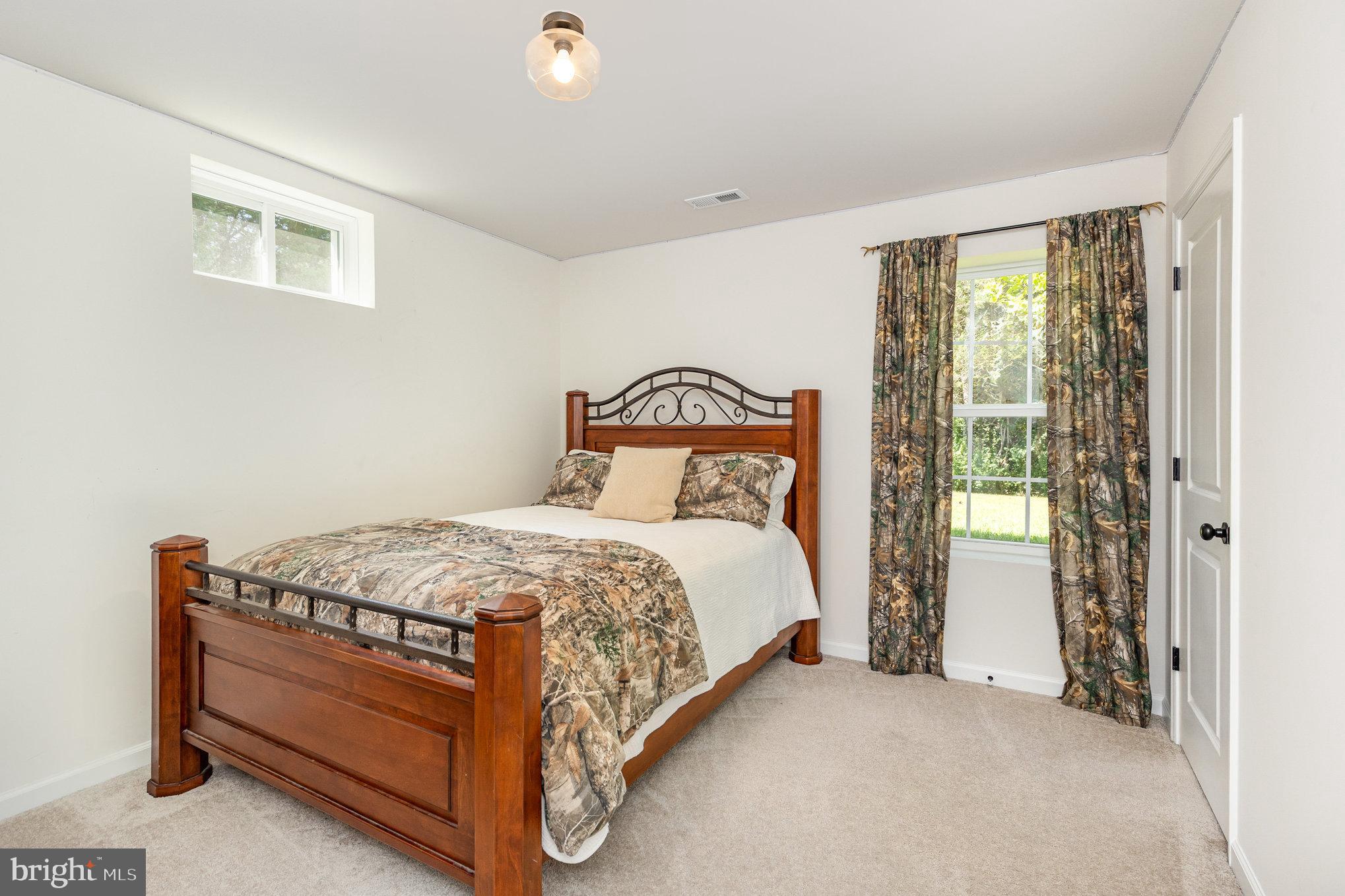5224 Pendleton Farm Road Bumpass, VA 23024 - Photo 26 of 31 a bedroom with a bed and window