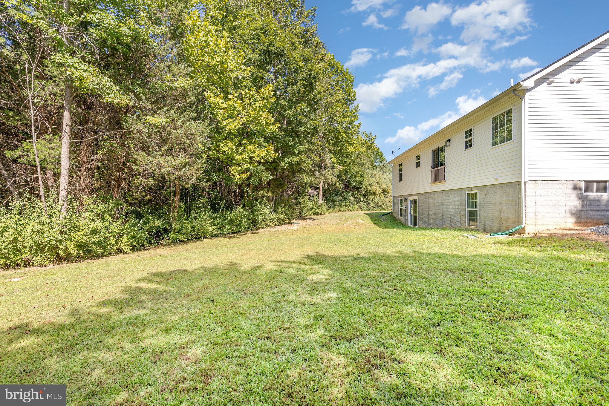 5224 Pendleton Farm Road Bumpass, VA 23024 - Photo 31 of 31 a view of a backyard of the house