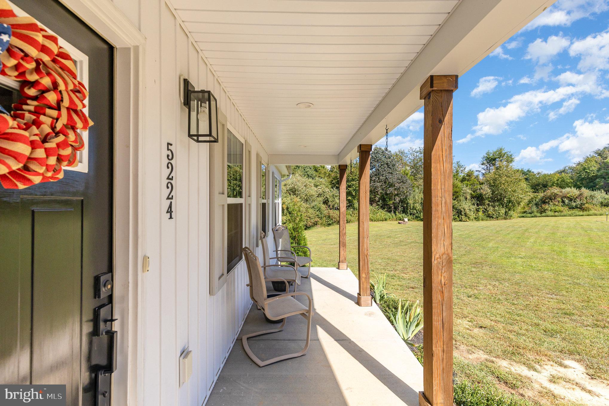 5224 Pendleton Farm Road Bumpass, VA 23024 - Photo 4 of 31 a view of a balcony with floor to ceiling windows and yard