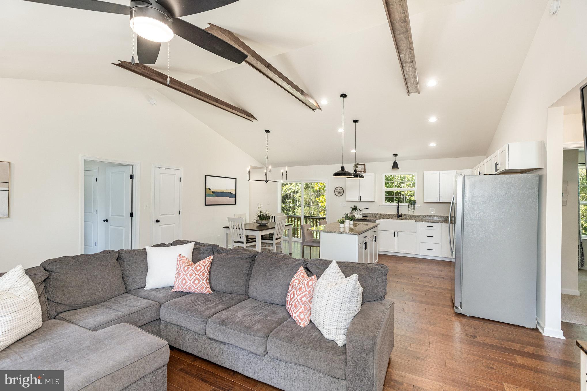 5224 Pendleton Farm Road Bumpass, VA 23024 - Photo 6 of 31 a living room with furniture and a chandelier