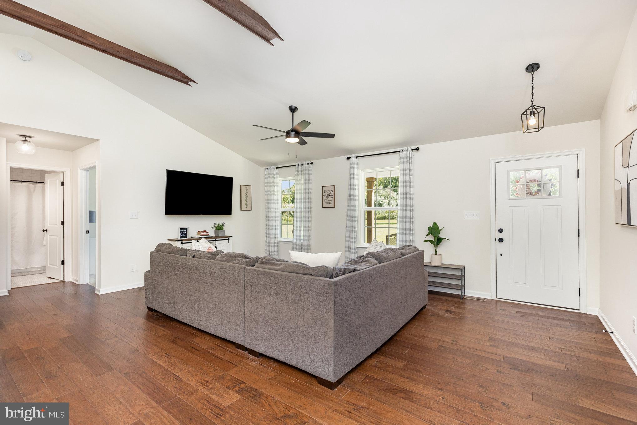 5224 Pendleton Farm Road Bumpass, VA 23024 - Photo 8 of 31 a living room with furniture and a flat screen tv