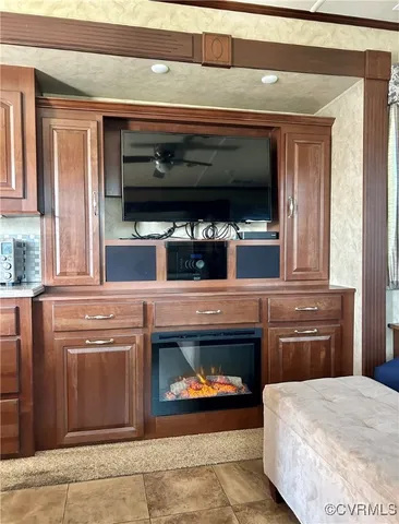 a living room with a fireplace and a fireplace