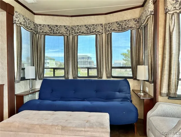 a bedroom with a large bed and a large window