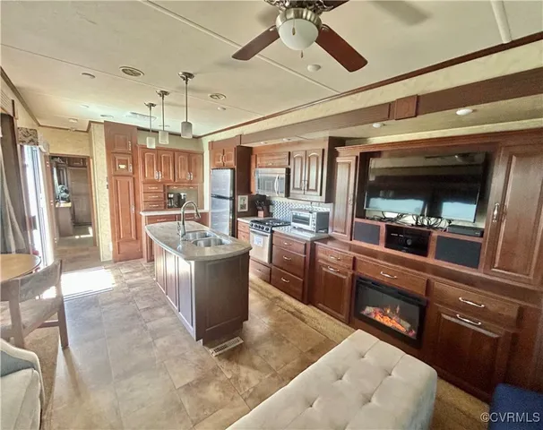 a large living room with stainless steel appliances granite countertop lots of counter top space