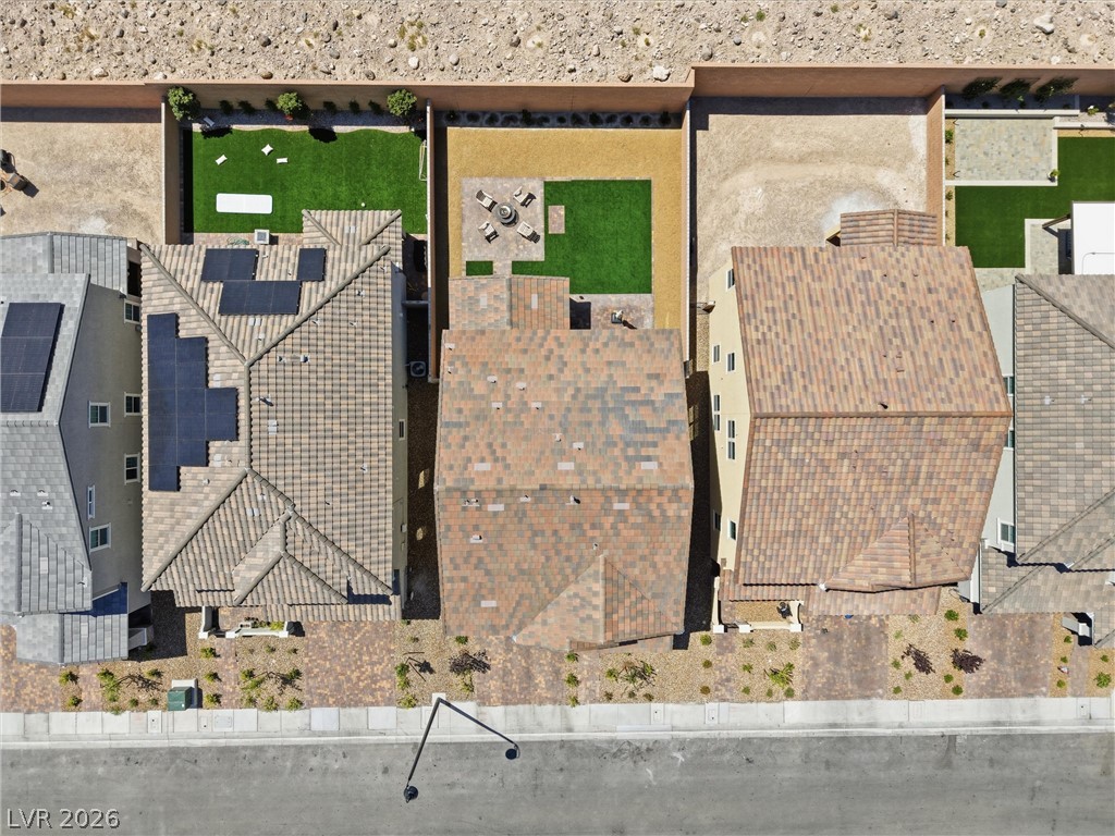 3705 Alla Rocca Avenue Henderson, NV 89044 - Photo 40 of 50 This aerial view showcases a vibrant community with inviting outdoor spaces and sustainable energy solutions.