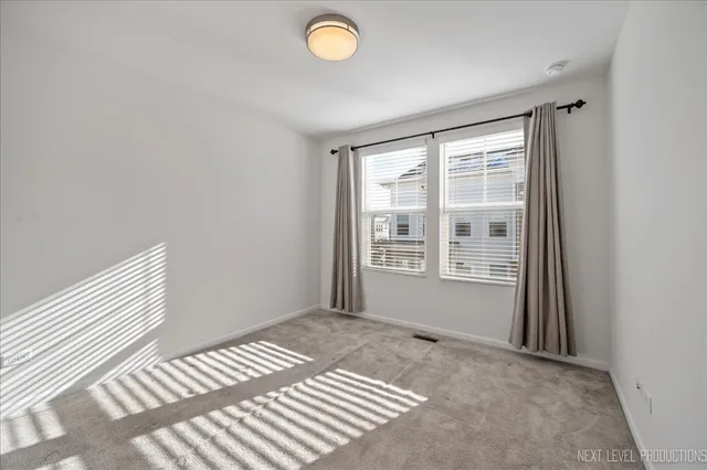 a spacious bedroom with a bed and a window