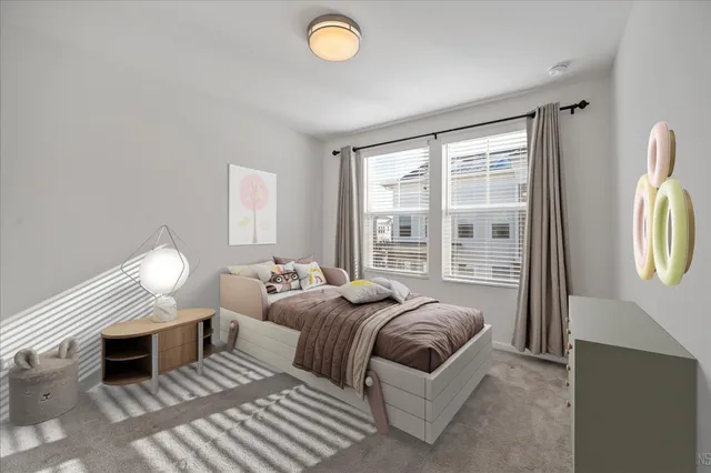 a view of a bedroom with wooden floor and a window