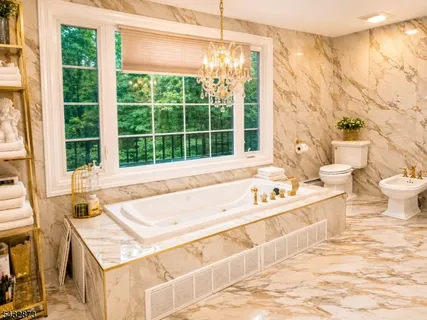 a bathroom with a tub sink and a large window