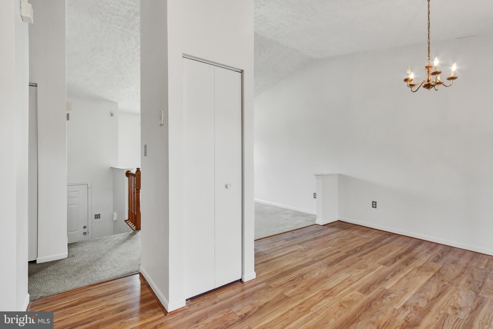 226 Stemmers Run Road Baltimore, MD 21221 - Photo 10 of 26 a view of a room with wooden floor and a ceiling fan