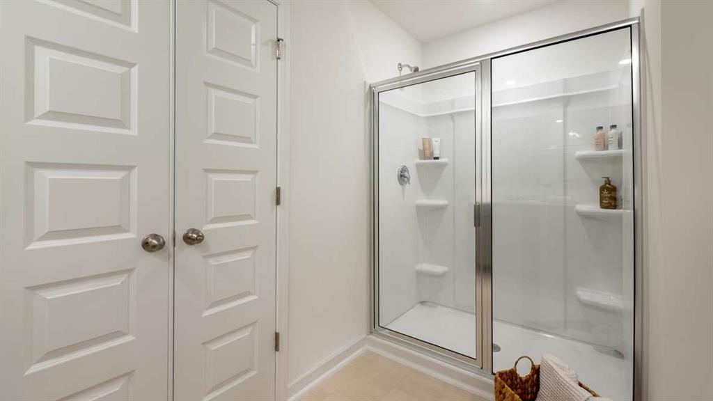 687 Alburgh Alley Mableton, GA 30126 - Photo 35 of 37 a bathroom with a glass shower door