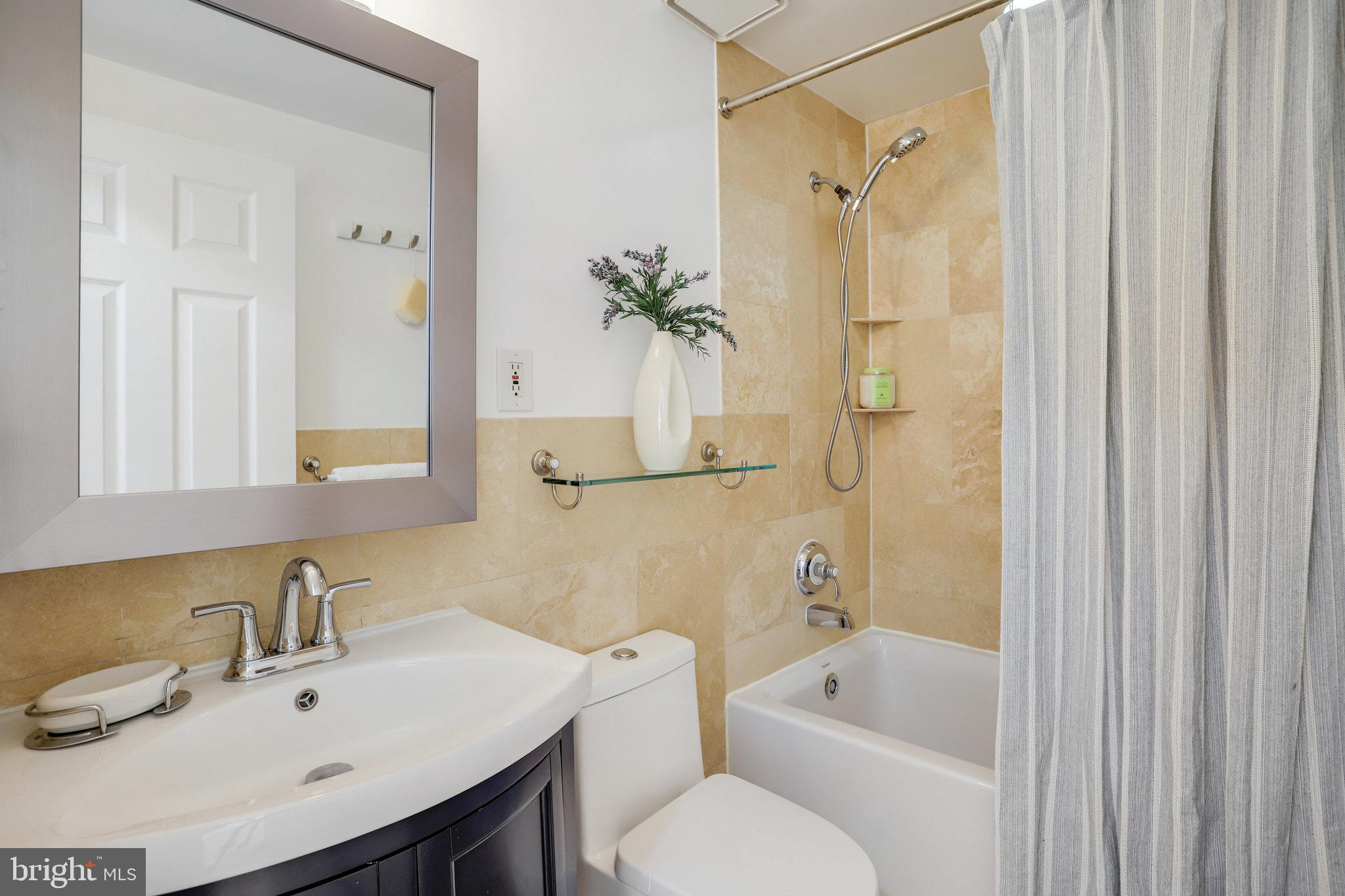 1616 Q Street Northwest, Unit 14 Washington, DC 20009 - Photo 19 of 28 UPDATED HALL BATHROOM